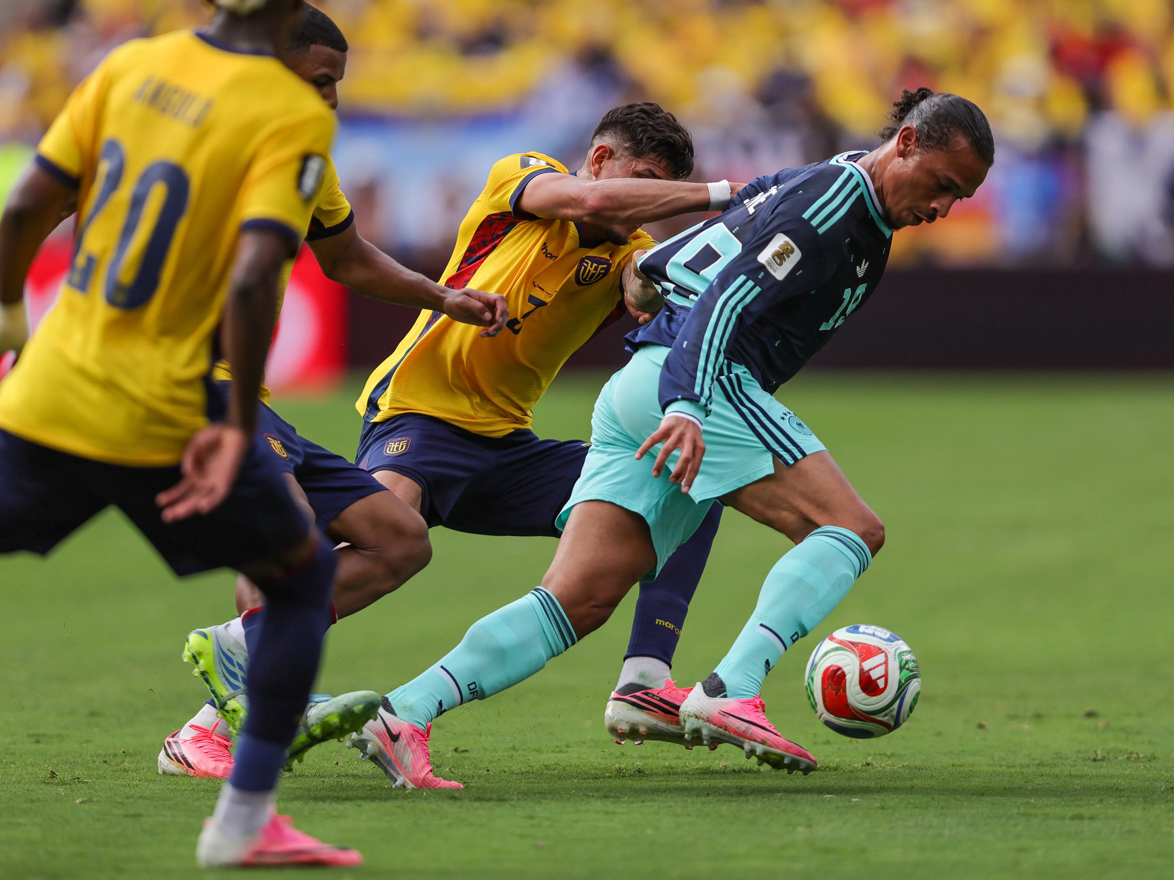 Germany forward LEROY SANE 19 dribbles the ball while Ecuador defender PIERO HINCAPIE 3 grabs his jersey during the 2026 FIFA World Cup