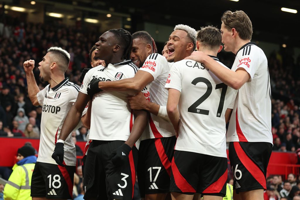 Calvin Bassey, Andreas Pereira,Alex Iwobi, Rodrigo Muniz, Timothy Castagne, and Sander Berge celebrate Bassey's opening goal 1-0 during the Manchester United 