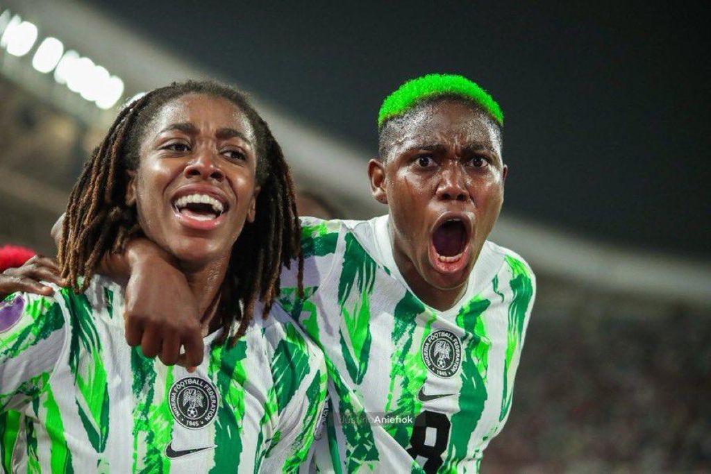 Jennifer Echegini and Asisat Oshoala celebrate Super Falcons' winner against Morocco in the WAFCON 2024 final