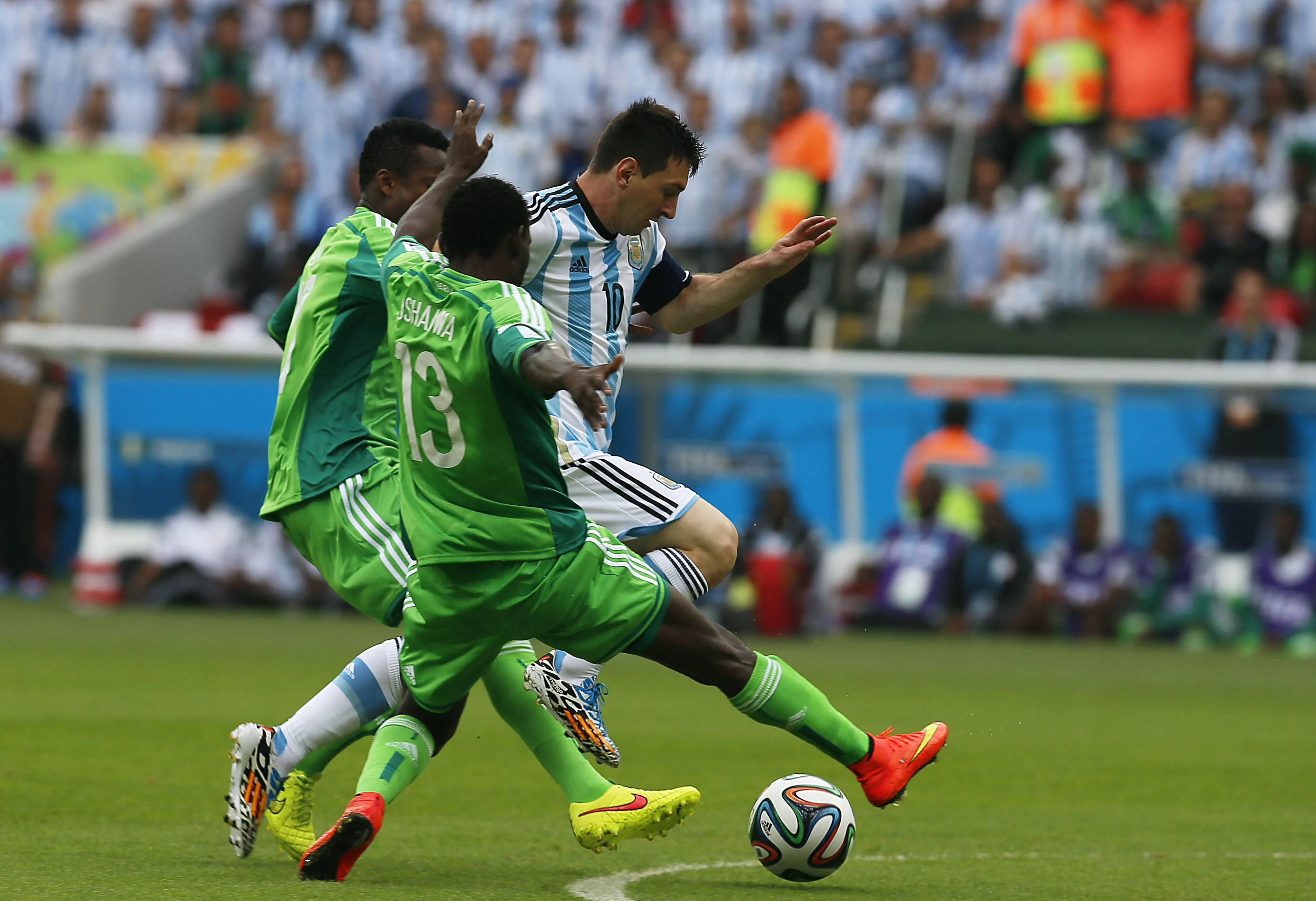 Lionel Messi of Argentina and Juwon Oshaniwa of Nigeria