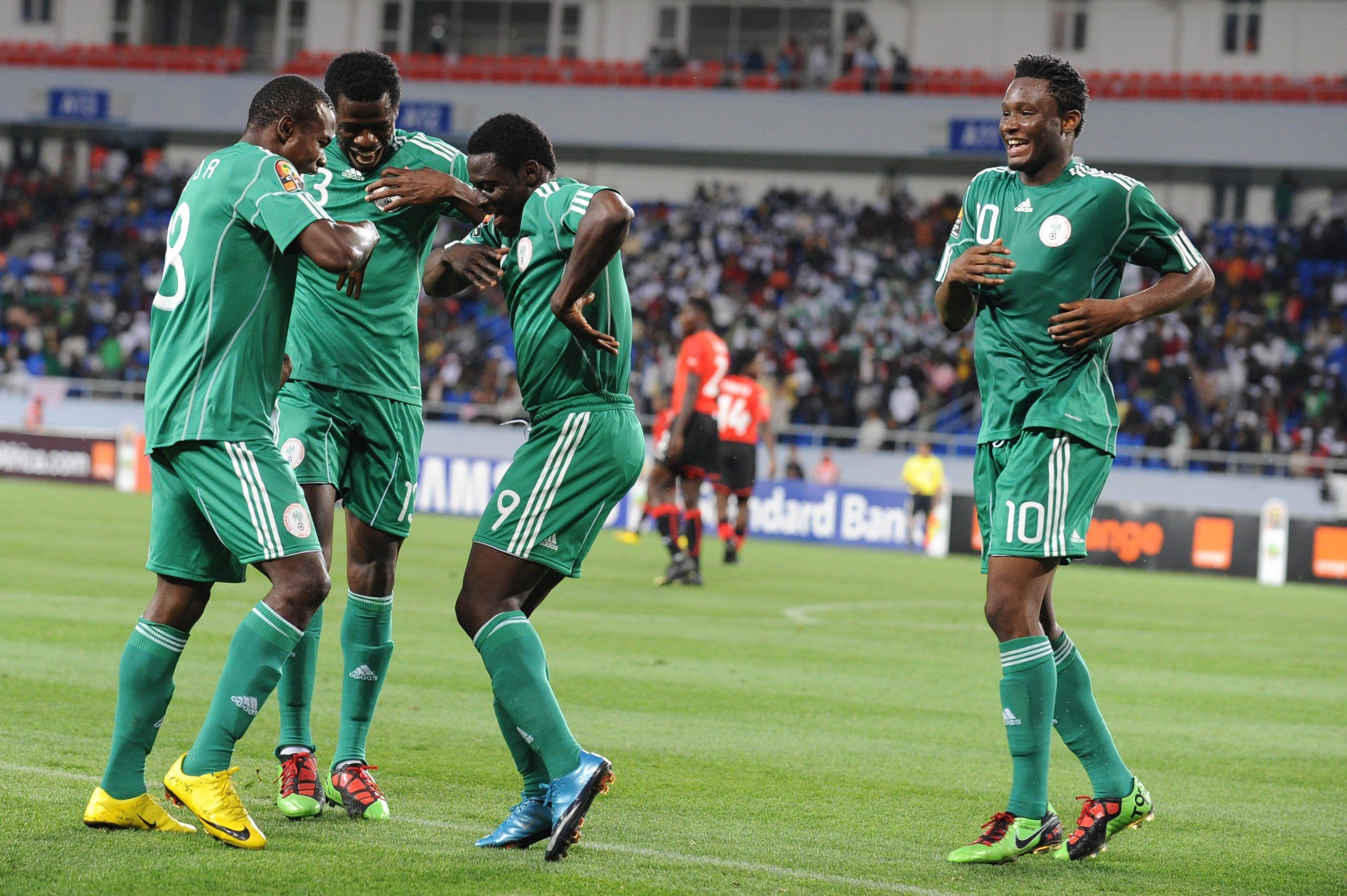 Obafemi Martins of Nigeria celebrates his goal with John Obi Mikel, Obinna Nsofor during the African Nations Cup match between Nigeria and Mozambique