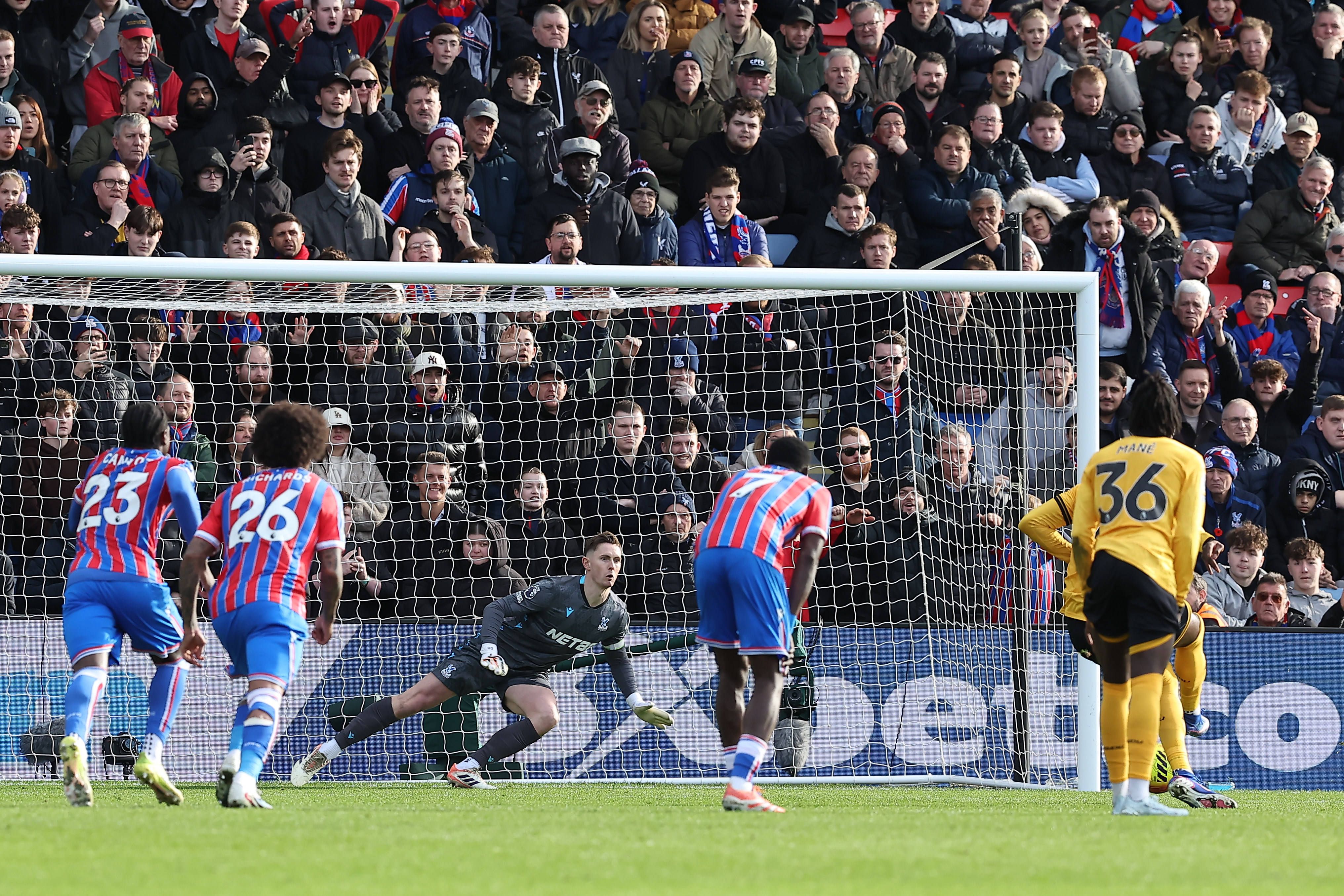 Dean Henderson saves Tolu Arokodare's penalty kick in the 43rd minute