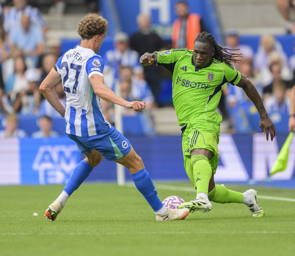 Calvin Bassey right battles with Brighton & Hove Albion's Mats Wieffer during the Premier League match between Brighton and Hove Albion and Fulham at the American Express Stadium