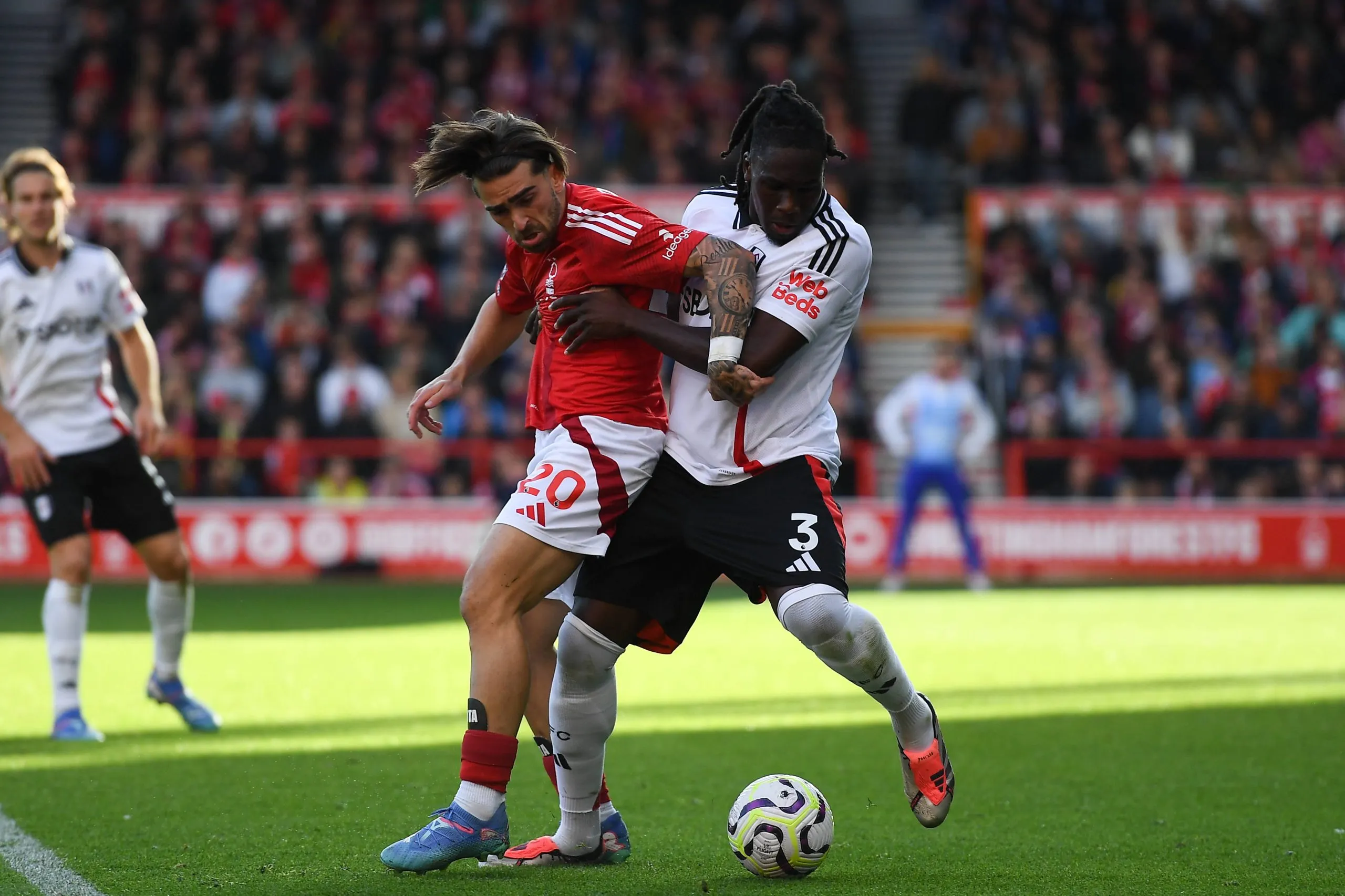 Jota Silva battles with Calvin Bassey during the Premier League match between Nottingham Forest and Fulham