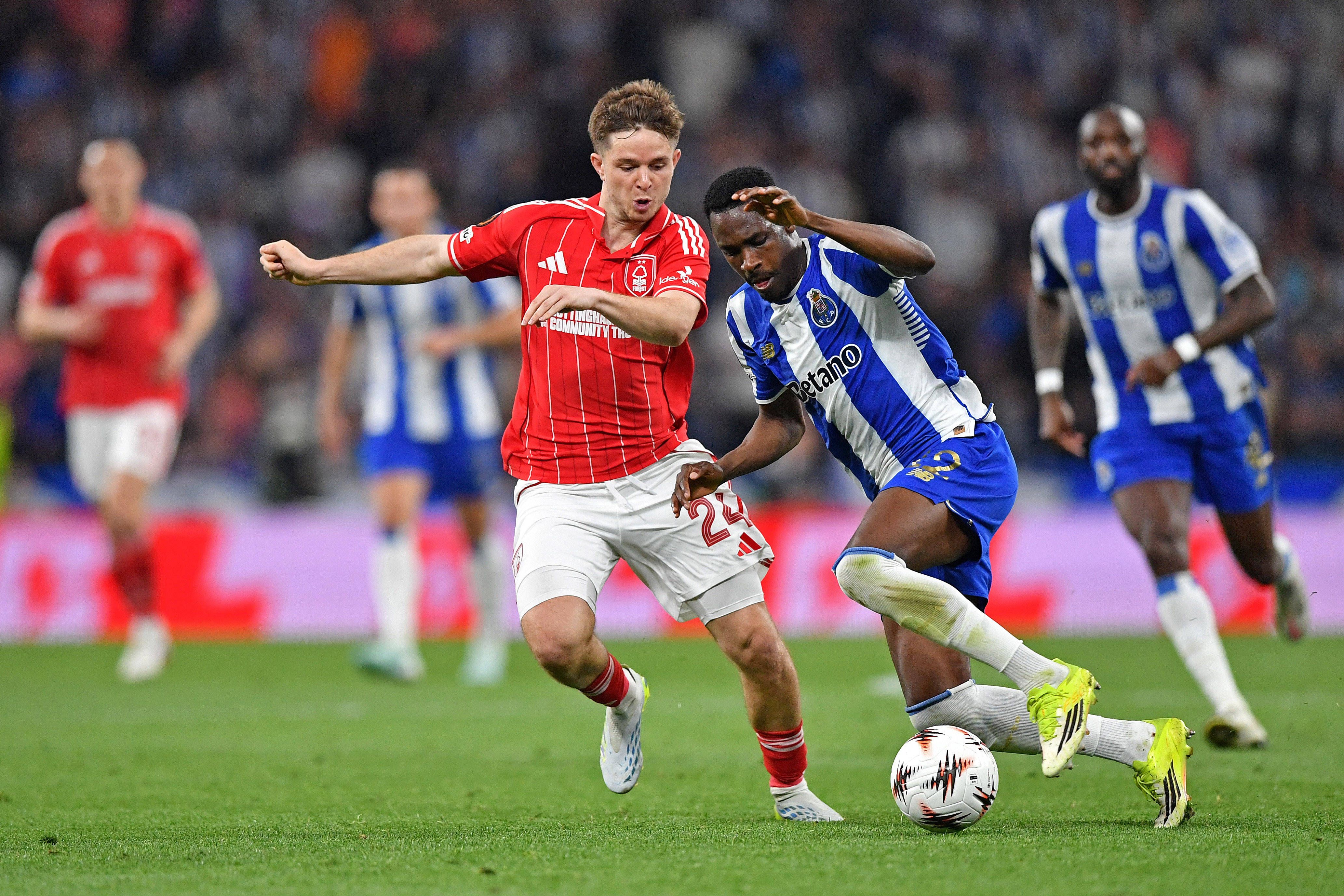 Zaidu Sanusi of FC Porto battles for possession ball with James McAtee of Nottingham Forest