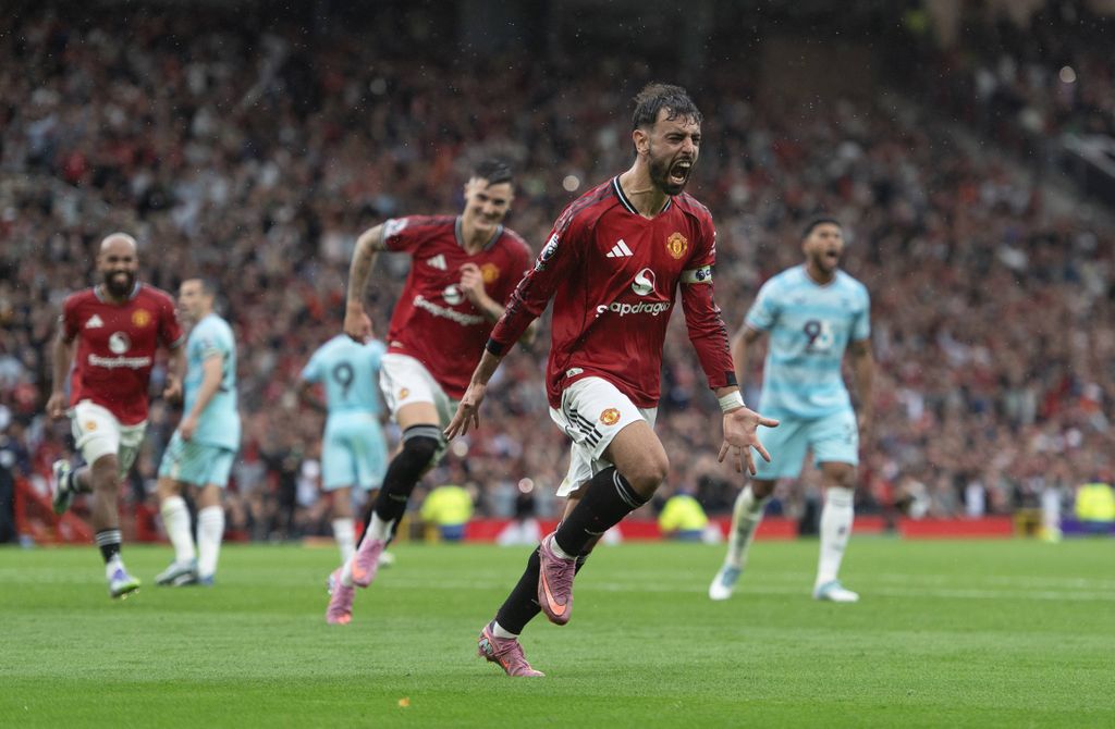 Bruno Fernandes celebrates scoring the third and winning goal from a penalty during the Premier League match between Manchester United and Burnley at Old Trafford