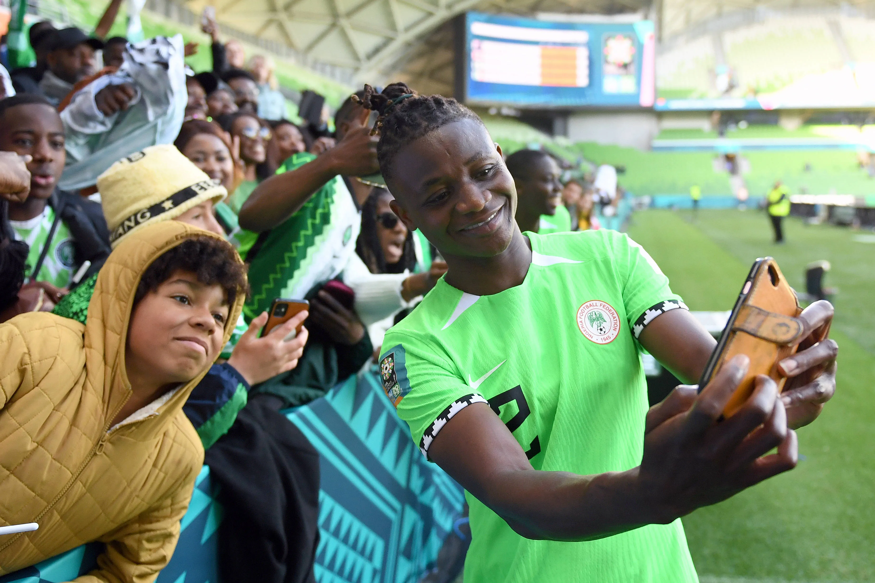 Uchenna Kanu of Nigeria takes a photo with fans
