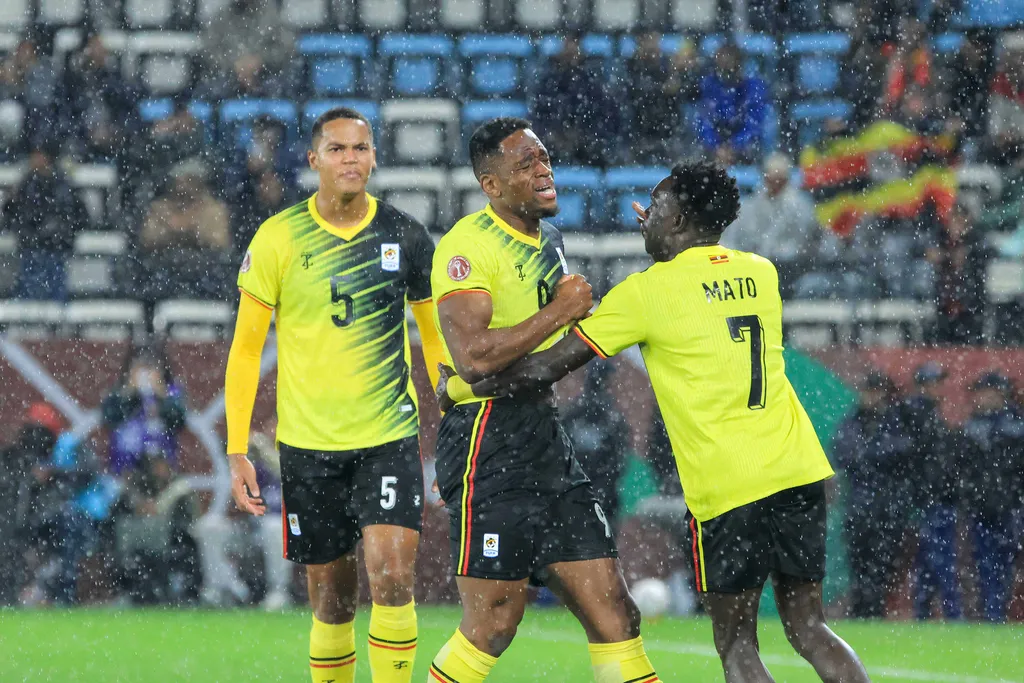 Uche Ikpeazu celebrates with his teammates after scoring during the group C match between Tanzania and Uganda