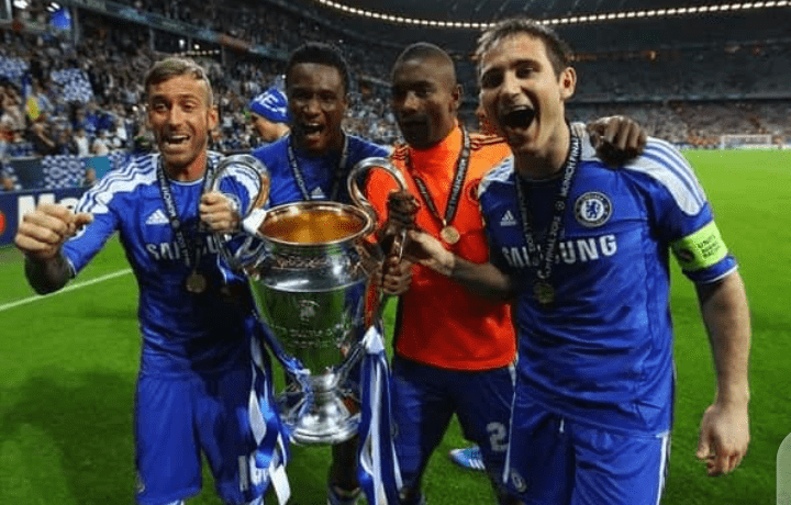 Mikel Obi and Chelsea teammates, with the 2012 UEFA Champions League trophy 