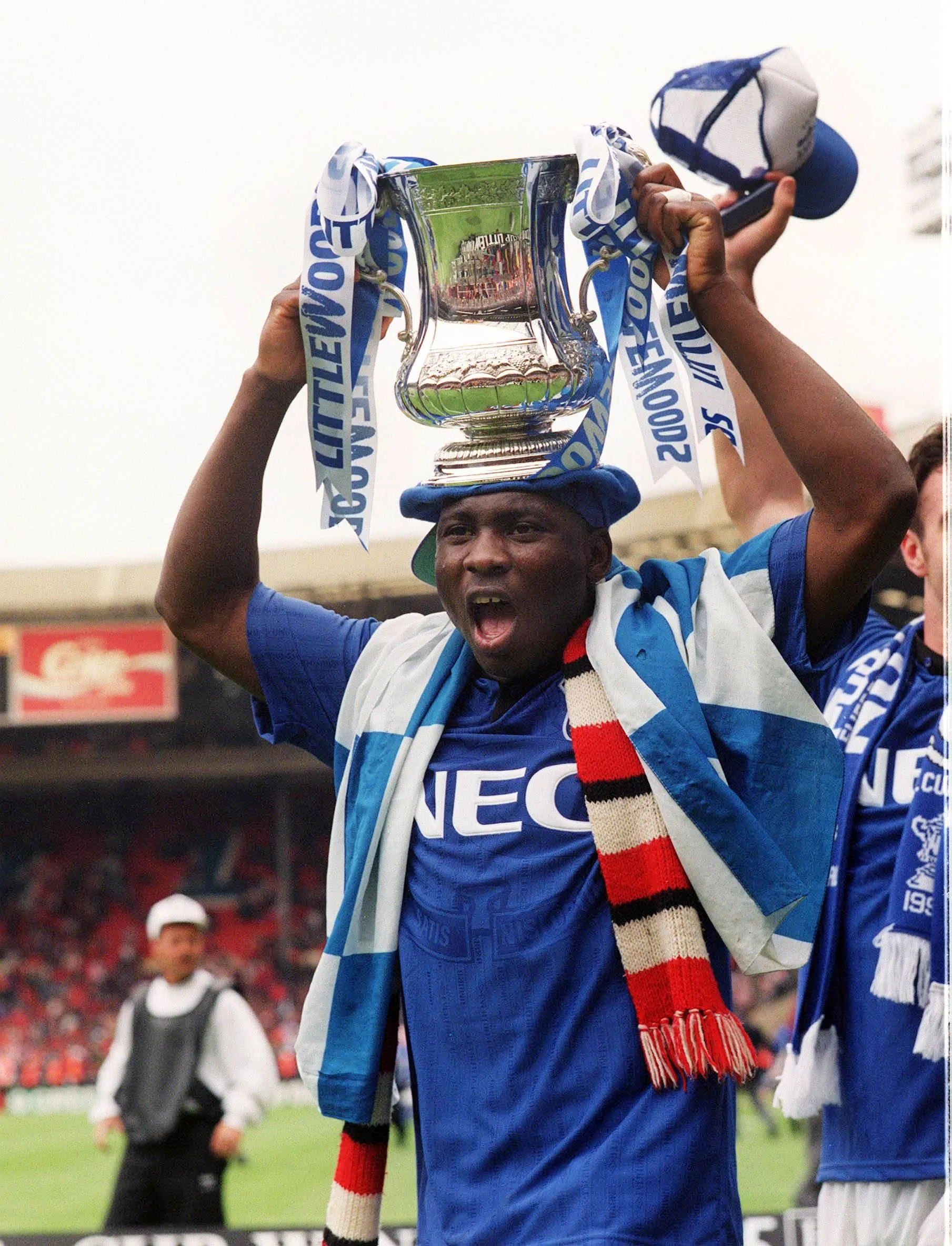 Daniel Amokachi with Everton's trophy.