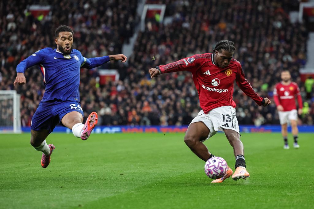 Reece James blocks a cross from Patrick Dorgu during the Premier League match Manchester United vs Chelsea at Old Trafford