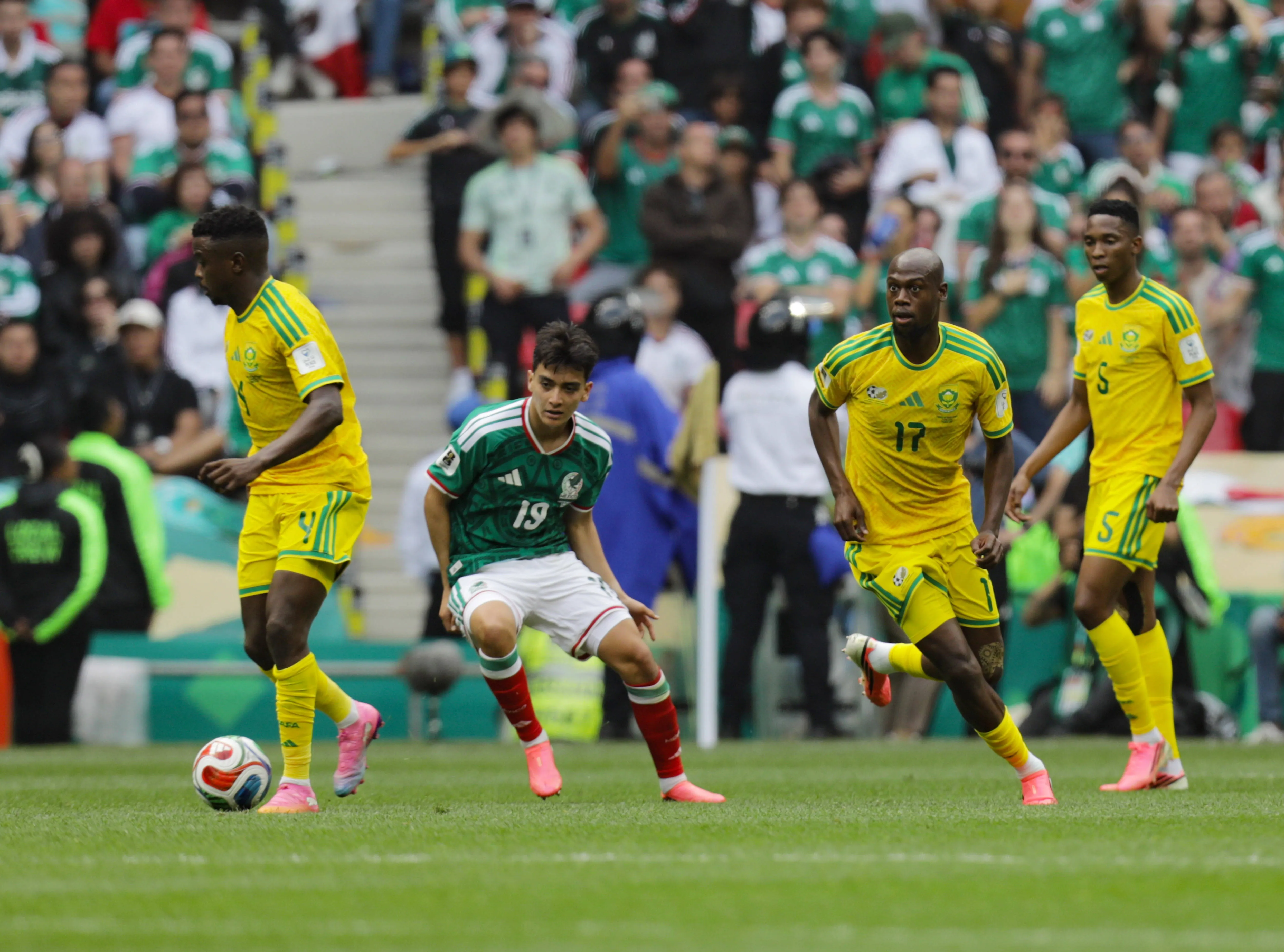 Teboho Mokoena 4 of South Africa is pressured by Gilberto Mora 19 of Mexico during the Group A first-round match of the 2026 FIFA World Cup at Estadio Azteca. on June 11, 2026, in Mexico City, Mexico.