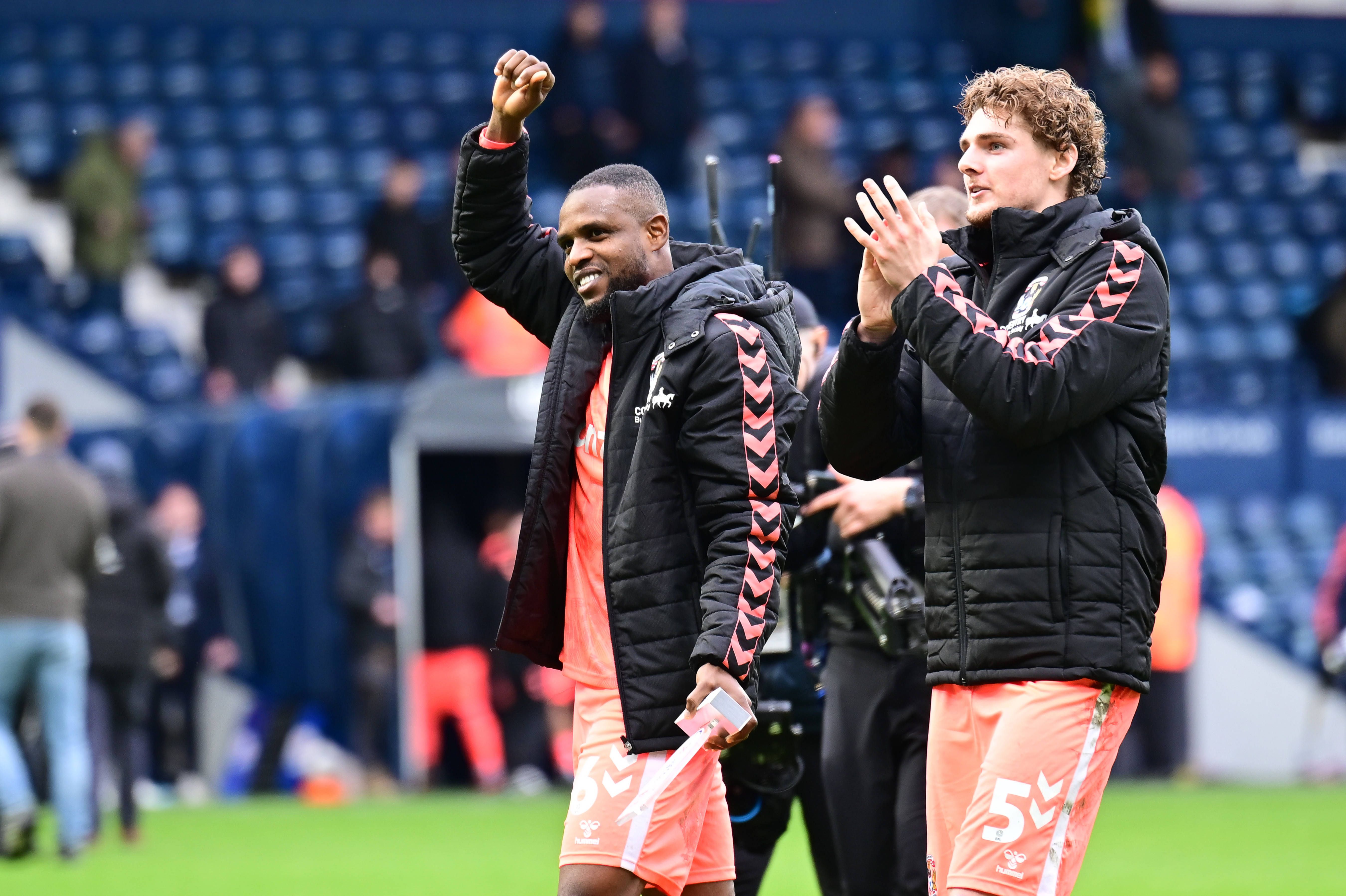Frank Onyeka and  Jack Rudoni applaud their fans in the match between West Bromwich Albion and Coventry City