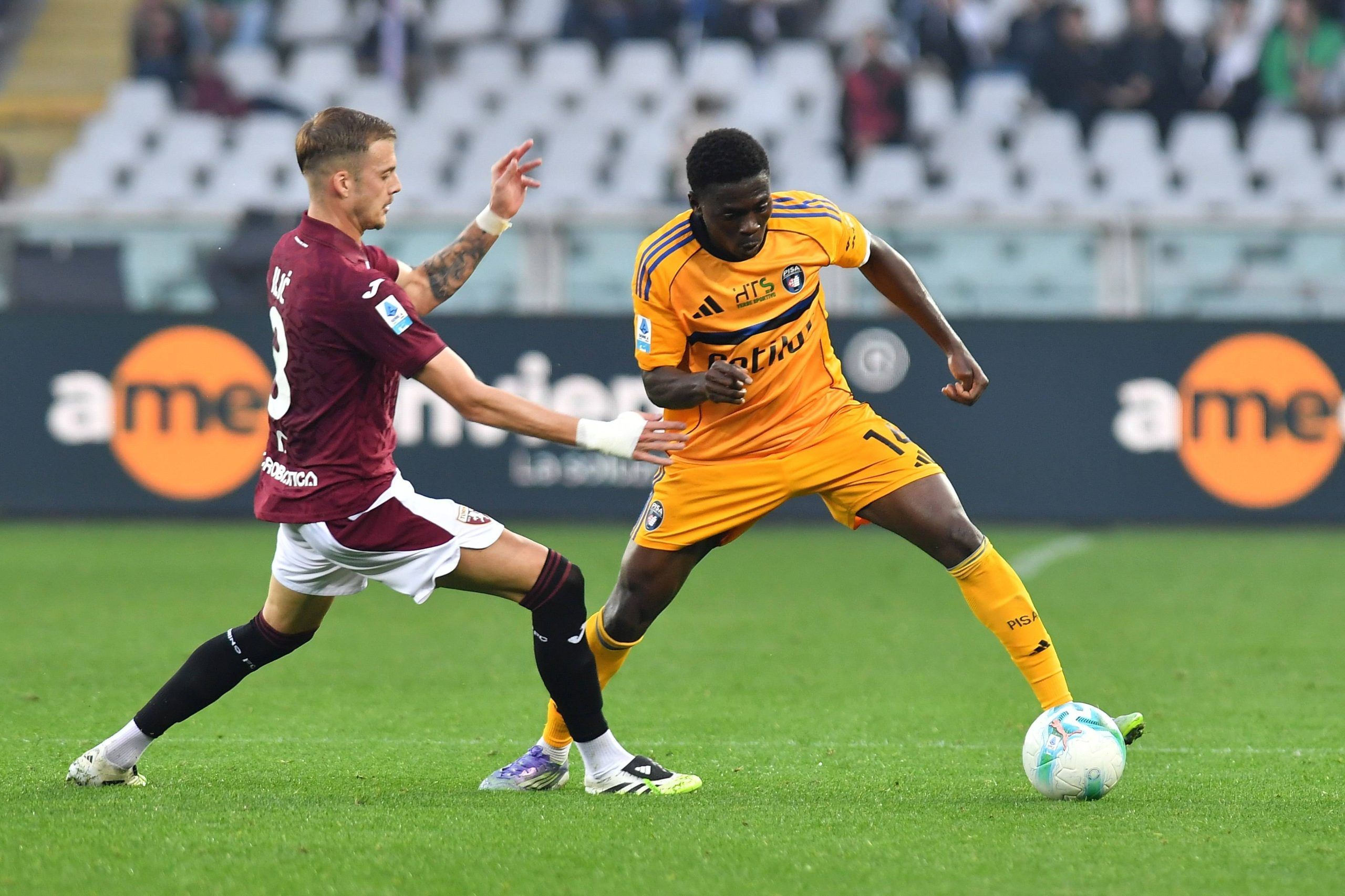 Ebenezer Akinsanmiro thwarted by Ivan Ilic during Torino FC vs Pisa SC