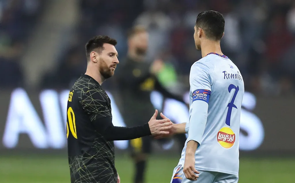 Riyadh All-Star XI vs Paris Saint-Germain FC Lionel Messi L and Cristiano Ronaldo great each other prior Riyadh All-Star XI vs Paris Saint-Germain FC