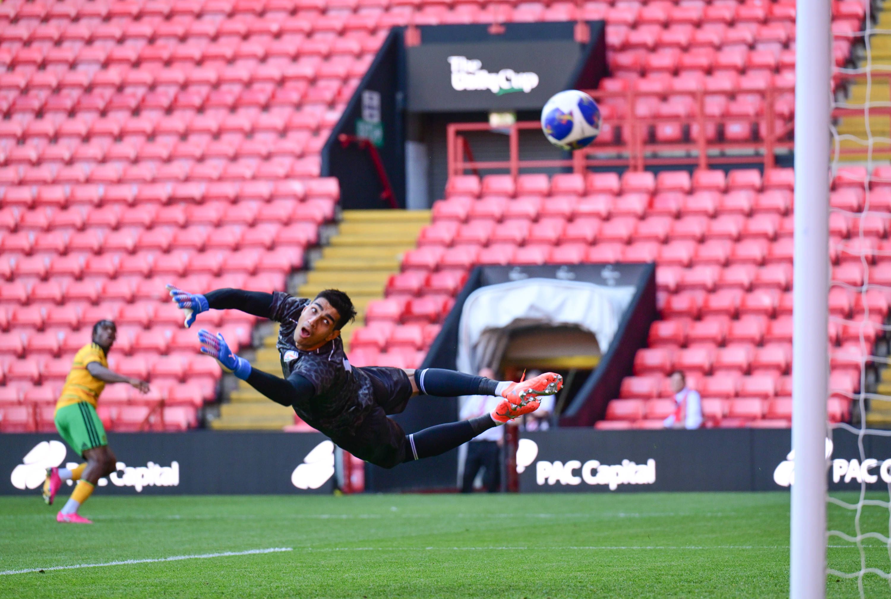Courtney Clarke of Jamaica shoots from deep to score