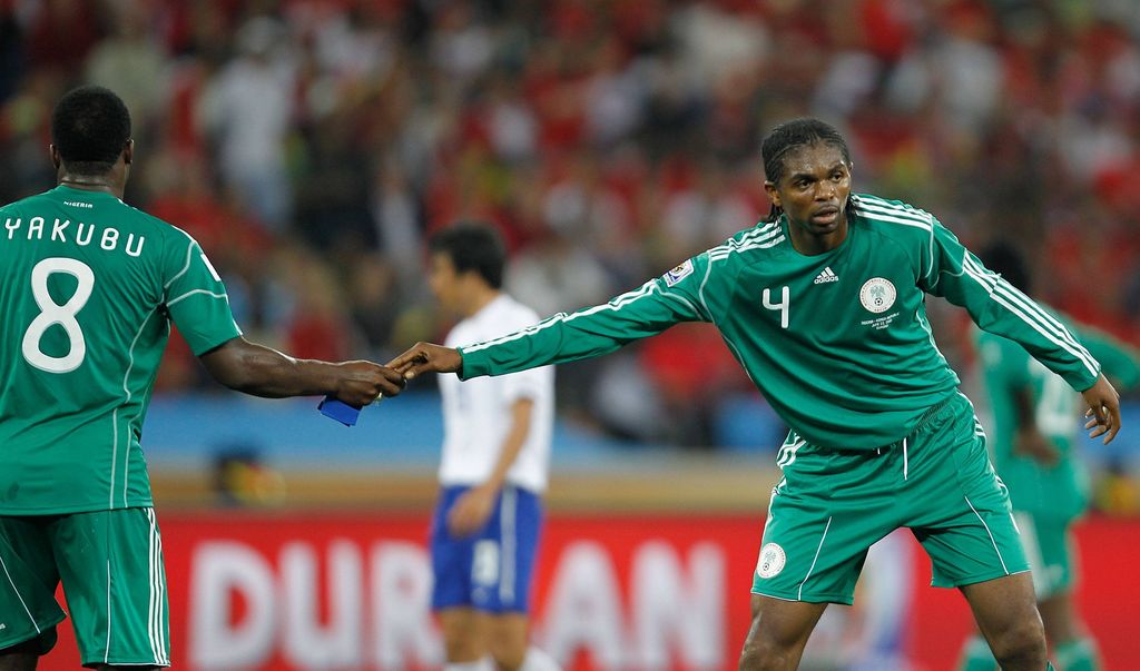 Nwankwo Kanu passes the captain's armband to his teammate Yakubu Ayegbeni
