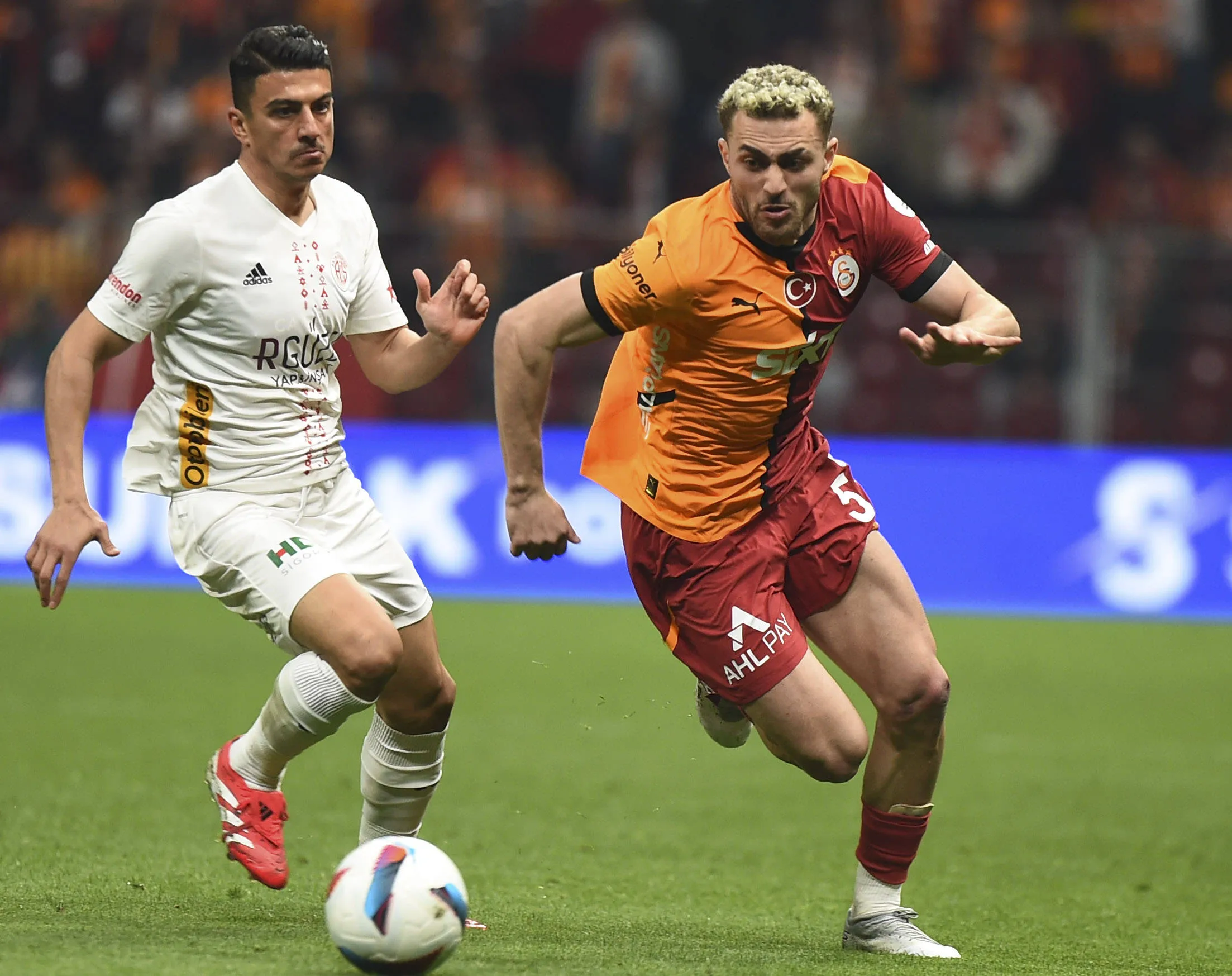 Baris Alper Yilmaz R of Galatasaray and Soner Dikmen L of Antalyaspor battle for the ball during the Turkish Super League match between Galatasaray and Antalyaspor at Rams Park Stadium