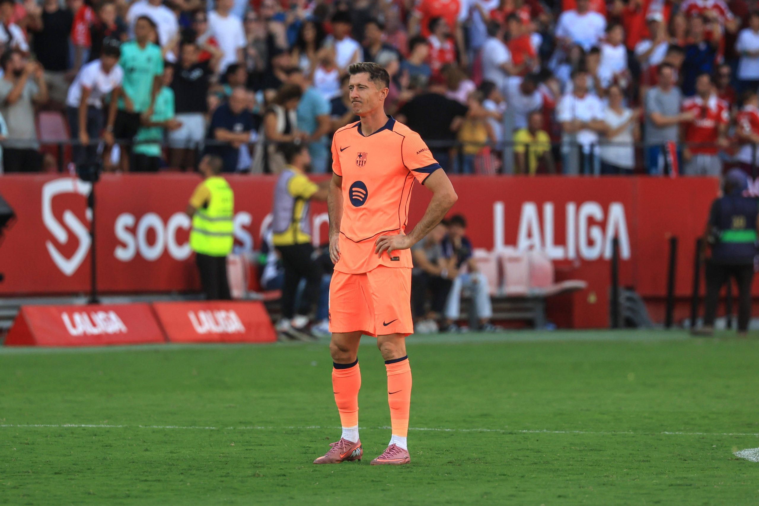 Robert Lewandowski looks dejected as Akor Adams just scored his team fourth goal during LaLiga match between Sevilla FC and FC Barcelona, at Estadio Ramon Sanchez Pizjuan in Sevilla, Spain