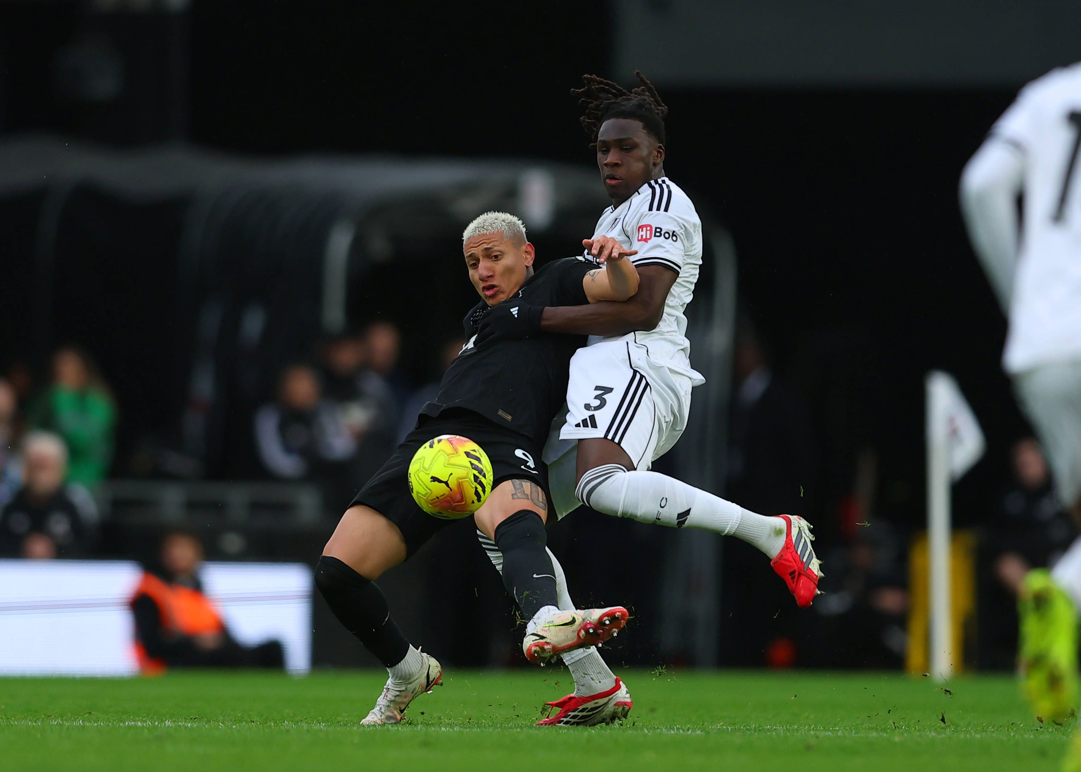 Richarlison under pressure from Calvin Bassey