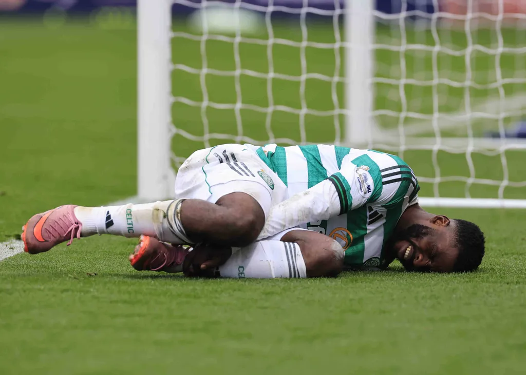 Kelechi Iheanacho holds his ankle during the William Hill Premiership match at Dens Park, Dundee