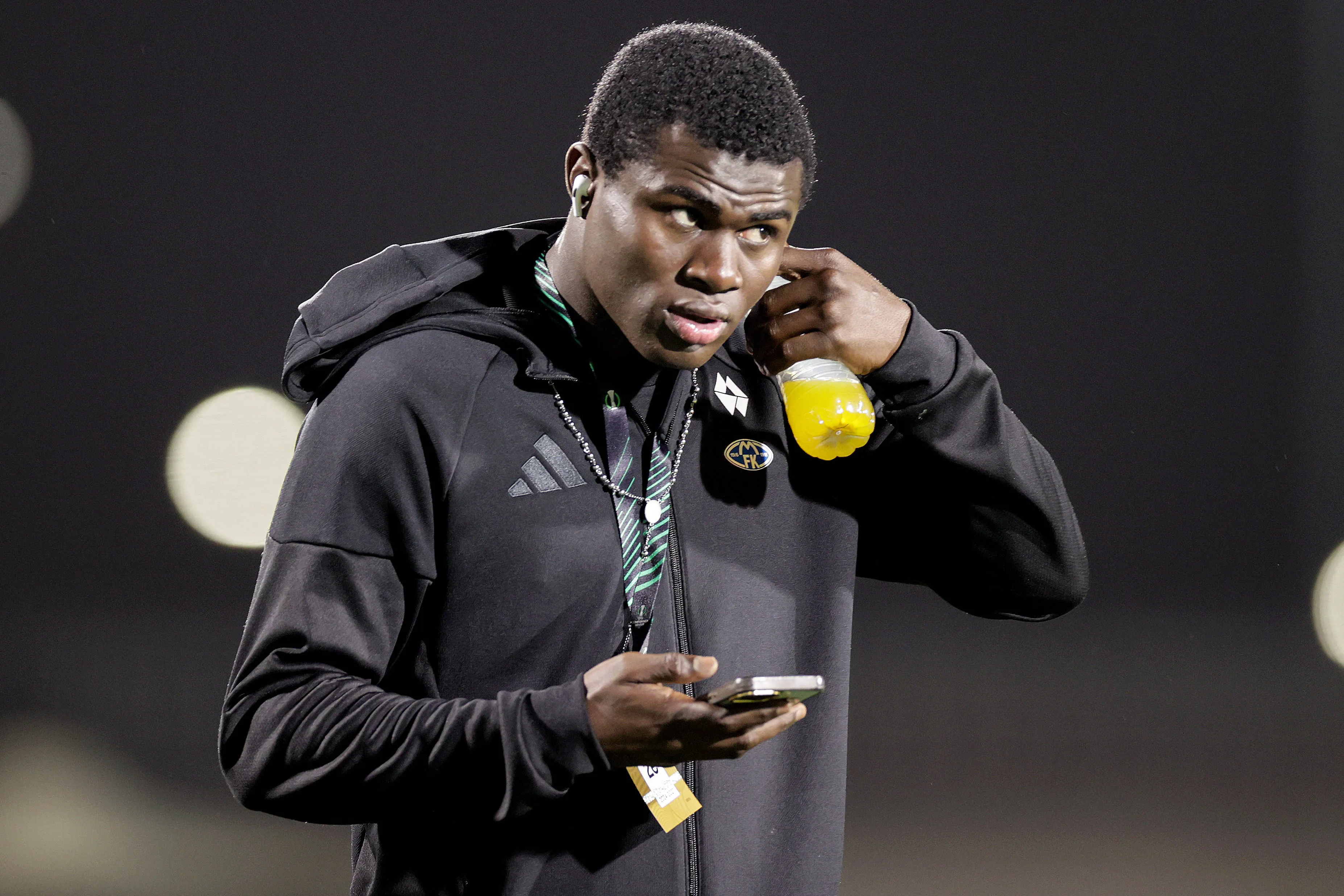 Molde's Daniel Daga inspects the pitch before the game.