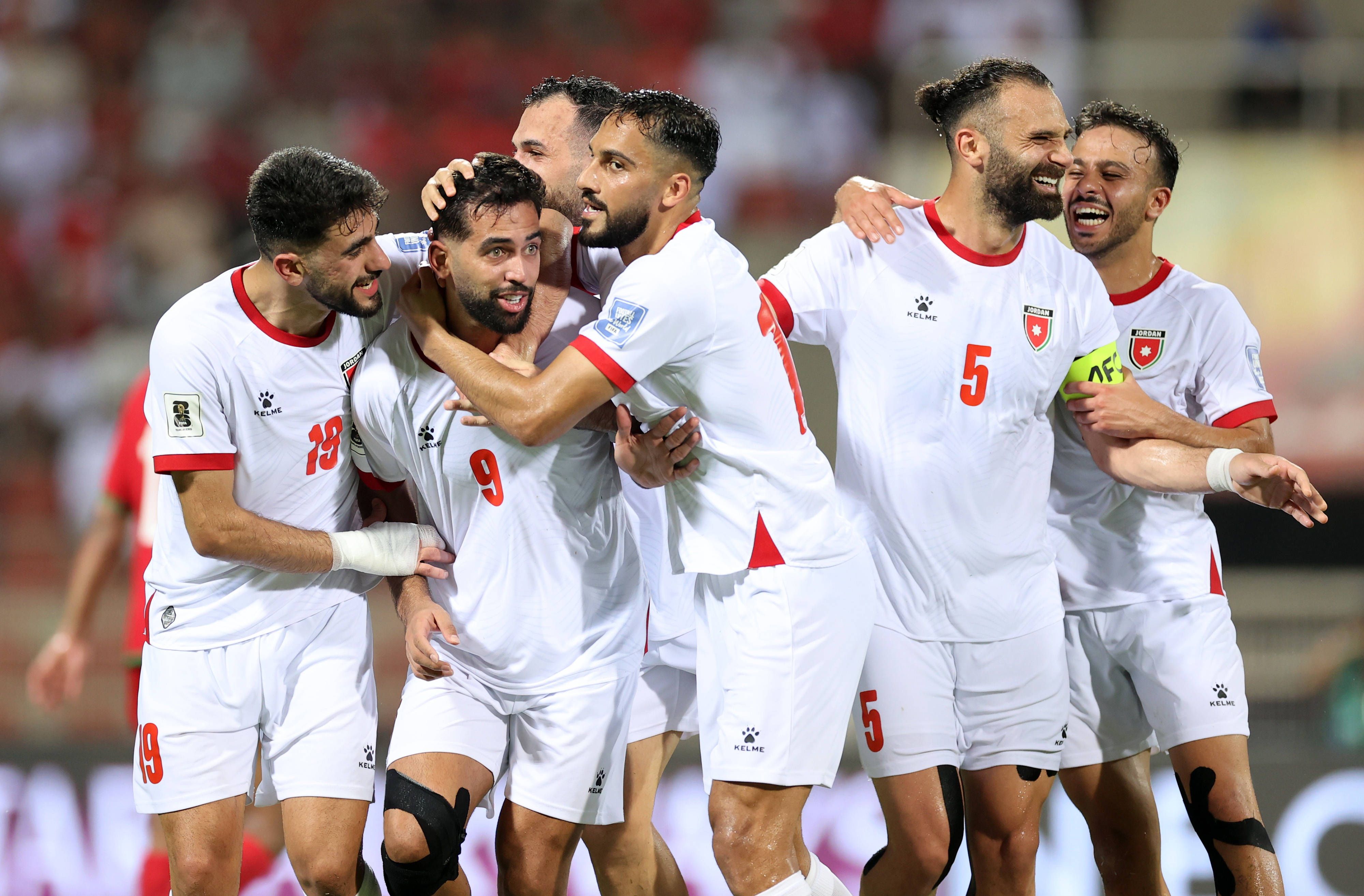Jordan players Ali Olwan, Mousa Al-Tamari, Amer Jamous, and Yazan Al-Arab celebrate