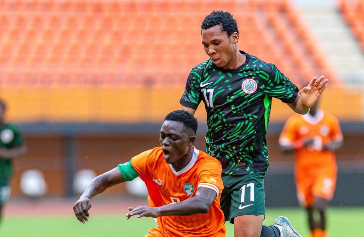 Flying Eagles star Divine Oliseh (in green kit)