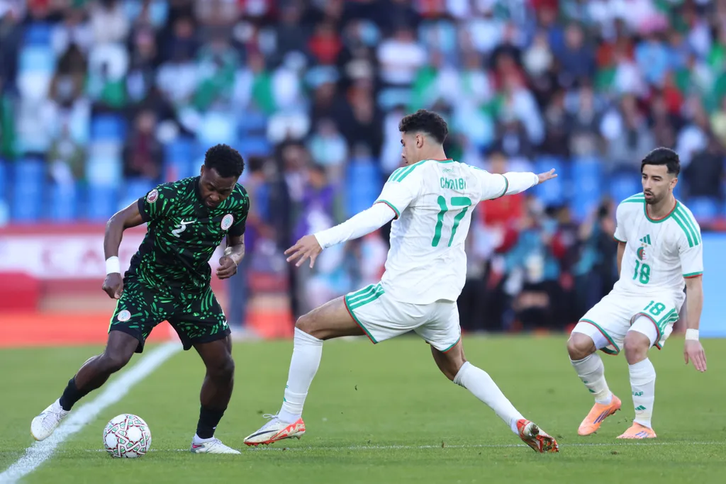 Bright Osayi-Samuel and Fares ChaÃbi during the Africa Cup Of Nations Quarter-final match between Algeria and Nigeria