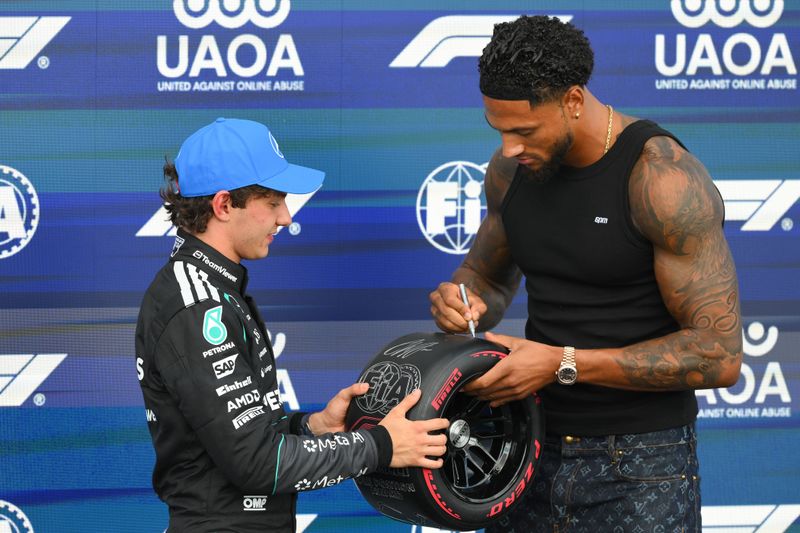 F1 Grand Prix of Great Britain - Kimi Antonelli of Italy and the Mercedes-AMG PETRONAS Formula One Team celebrates with Maduka Okoye after securing P1 during qualifying for the Formula 1 Pirelli British Grand Prix 2026 at Silverstone Circuit, Towcester