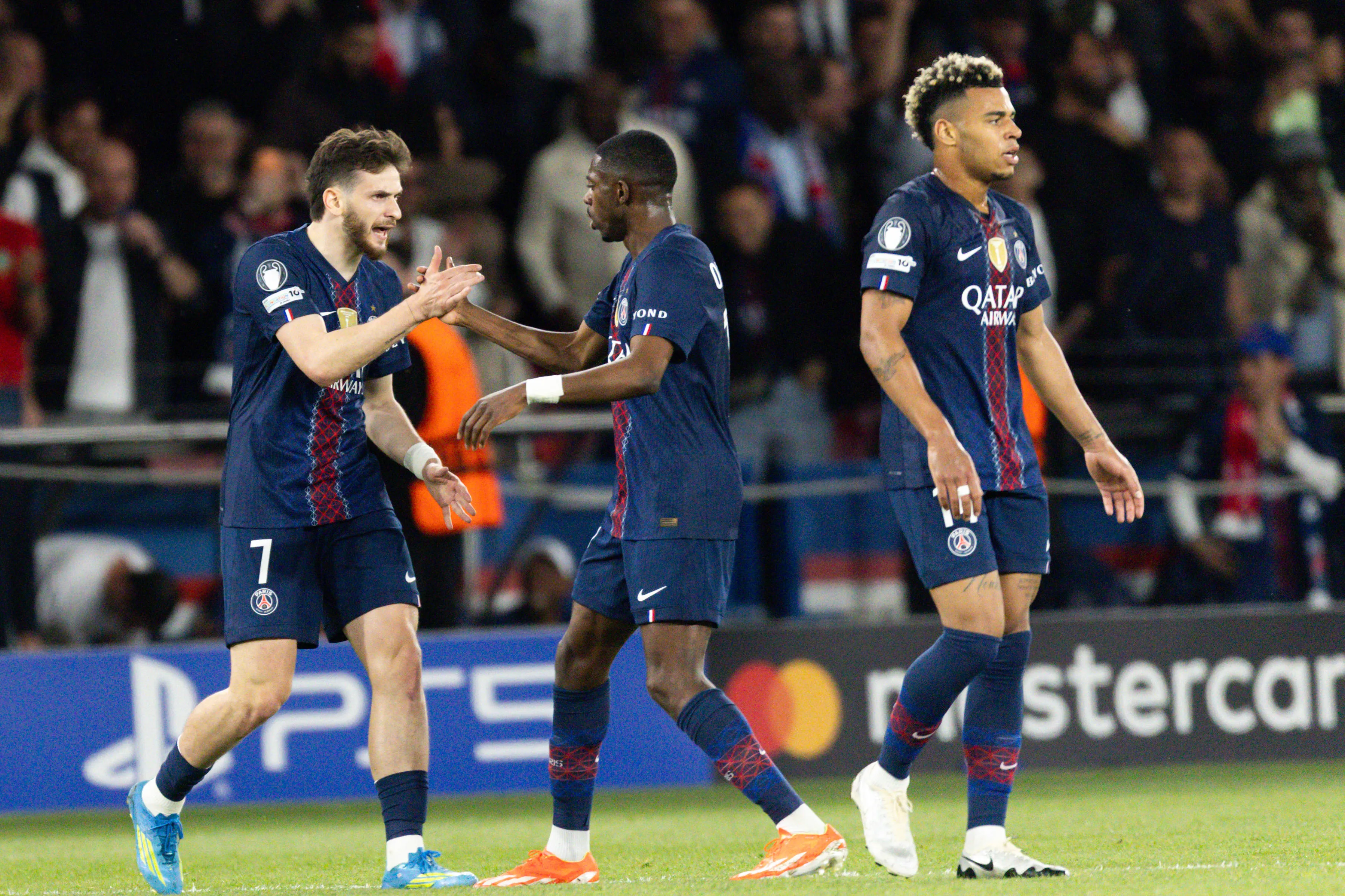 Khvicha Kvaratskhelia of Paris Saint-Germain L celebrates with Ousmane Dembele of Paris Saint-Germain R after scoring a goal during the UEFA Champions League semi-final first leg match between Paris Saint-Germain and Bayern Munich at the Parc des Princes in Paris