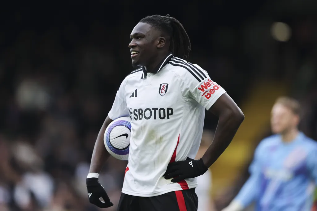 Calvin Bassey of Fulham holding the match ball