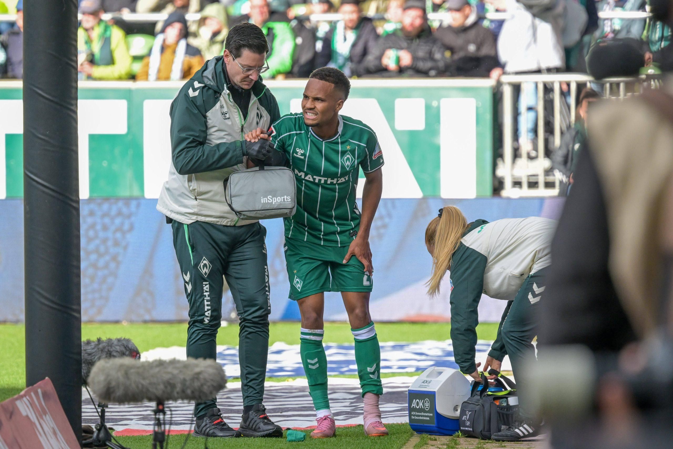 Felix Agu helped off the pitch at Werder Bremen