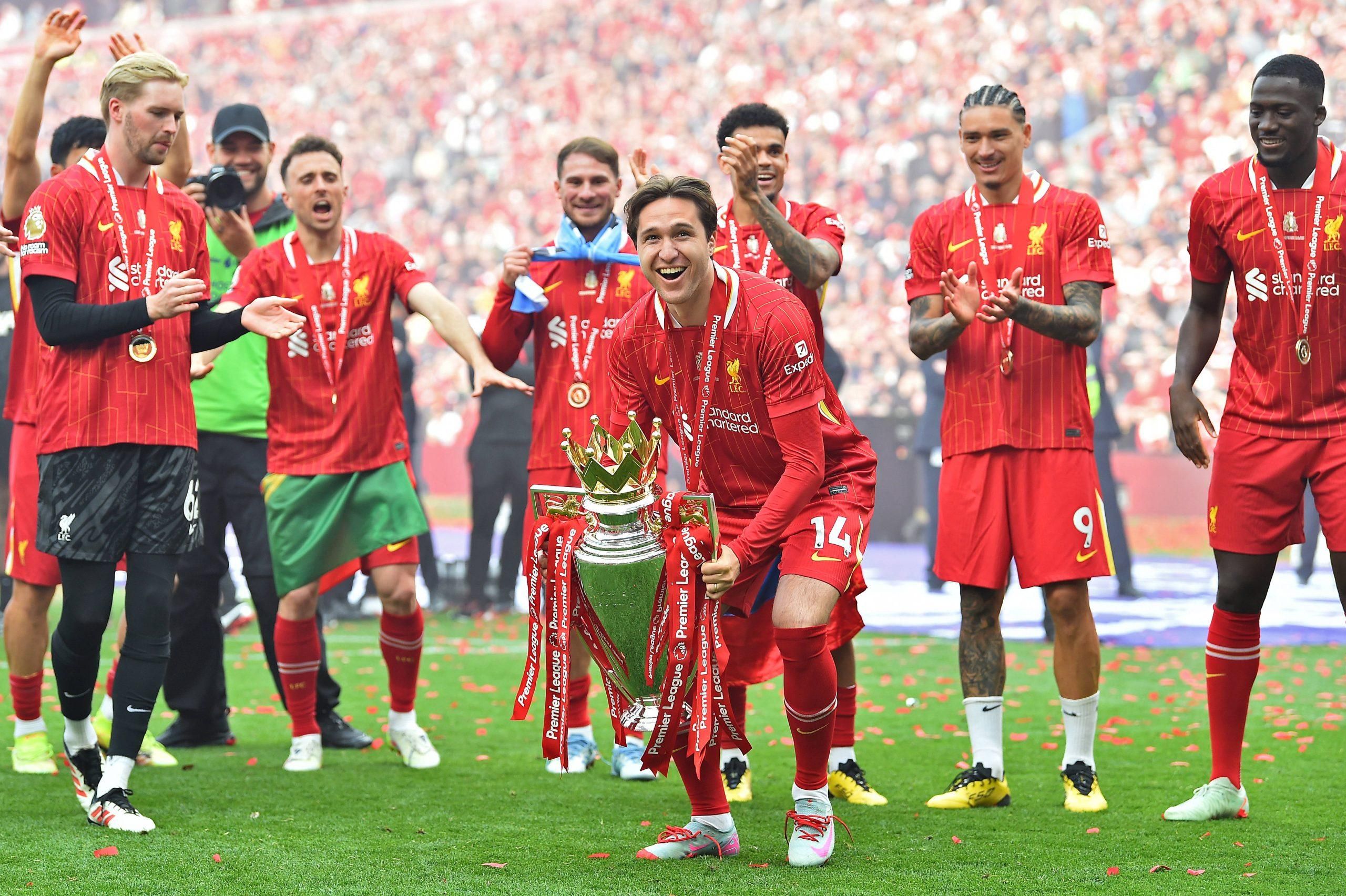 Darwin Nunez applauds as Federico Chiesa of Liverpool lifts the Premier League Trophy during the Liverpool vs Crystal Palace Premier League match at Anfield