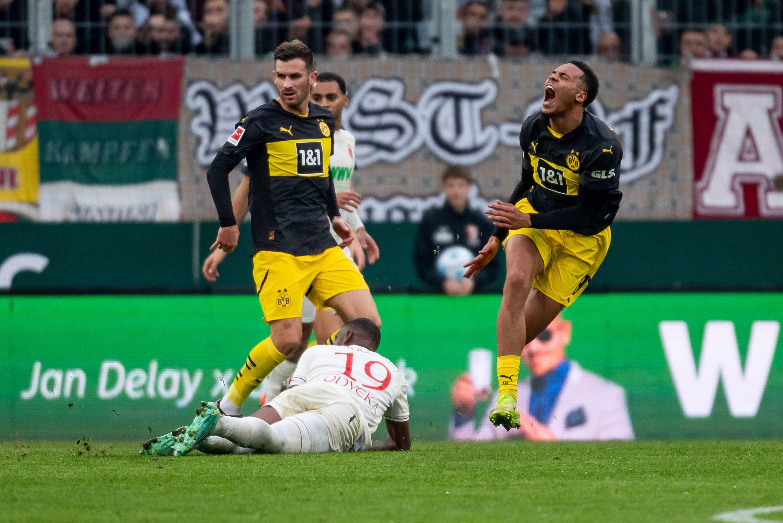 Felix Nmecha Borussia Dortmund, 8 with pain after a duel with Frank Onyeka FC Augsburg 