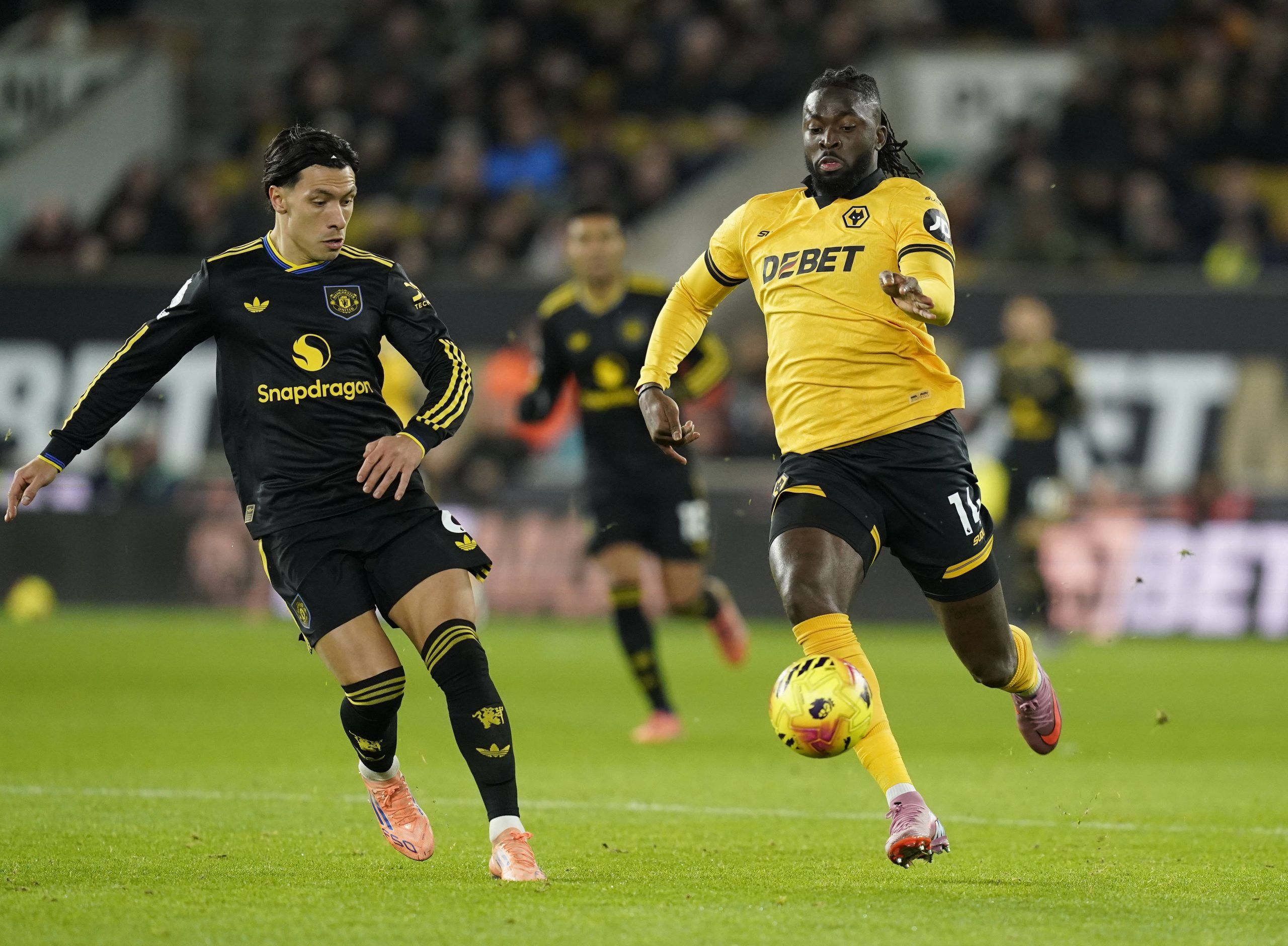 Lisandro Martinez tracks Tolu Arokodare during the Wolverhampton Wanderers vs Manchester United Premier League match