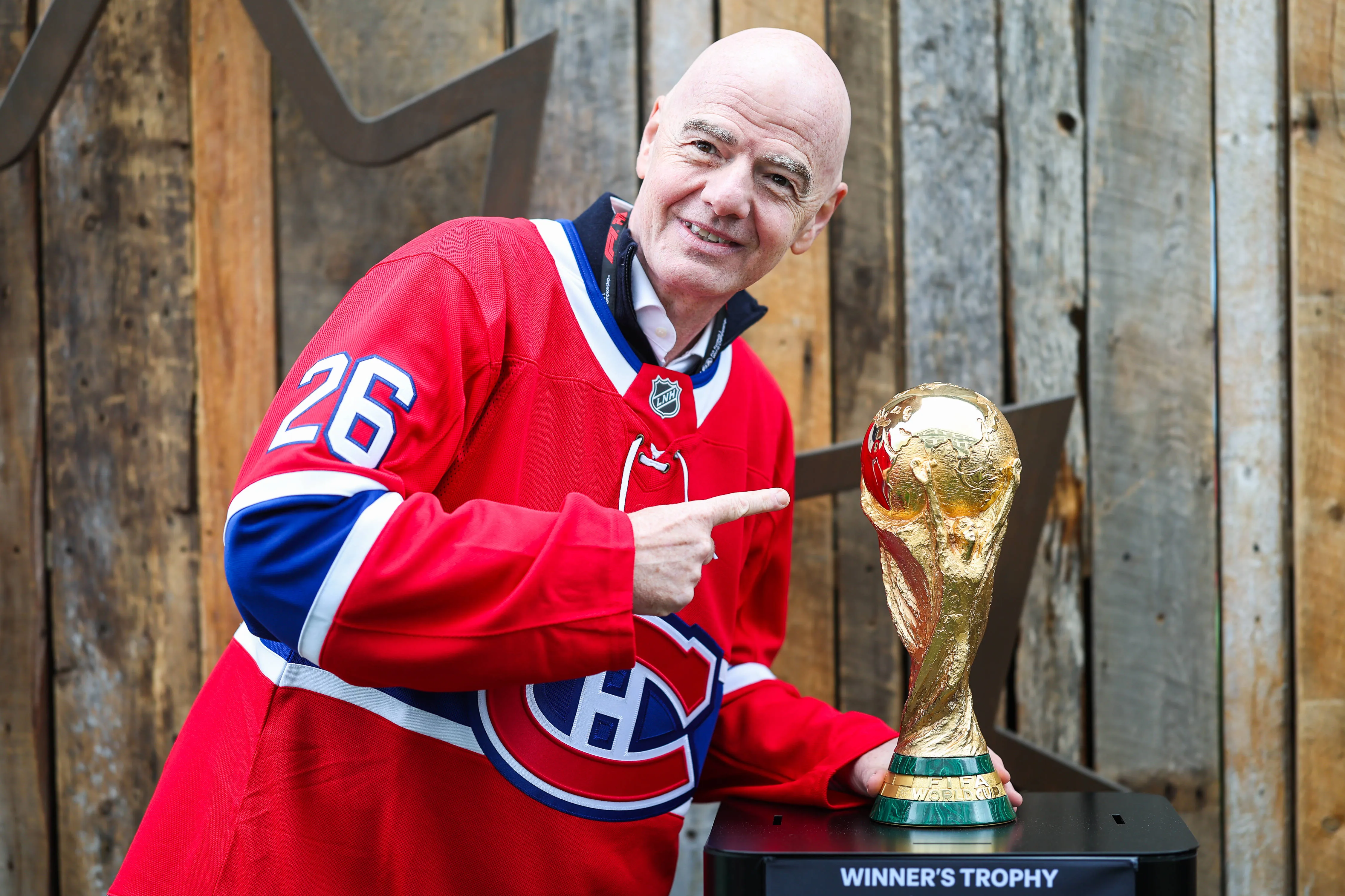 FIFA president Gianni Infantino poses for photos with FIFA World Cup trophy
