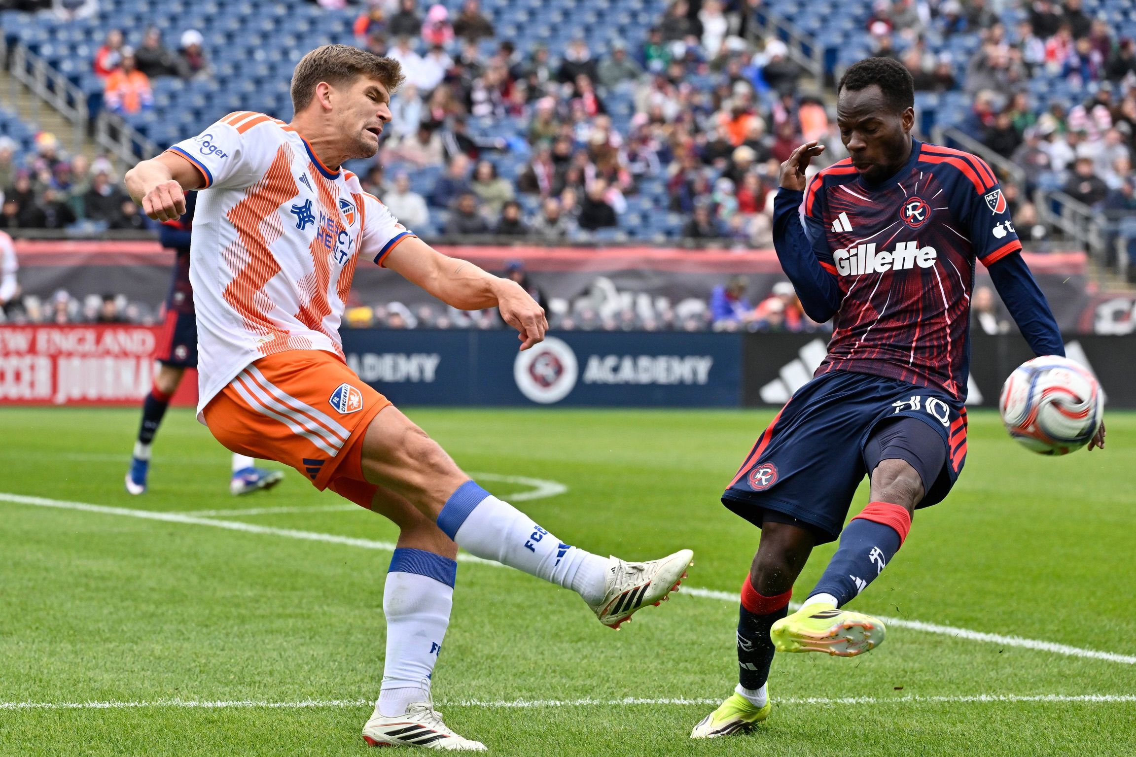 Cincinnati defender Nick Hagglund and New England Revolution midfielder Alhassan Yusuf