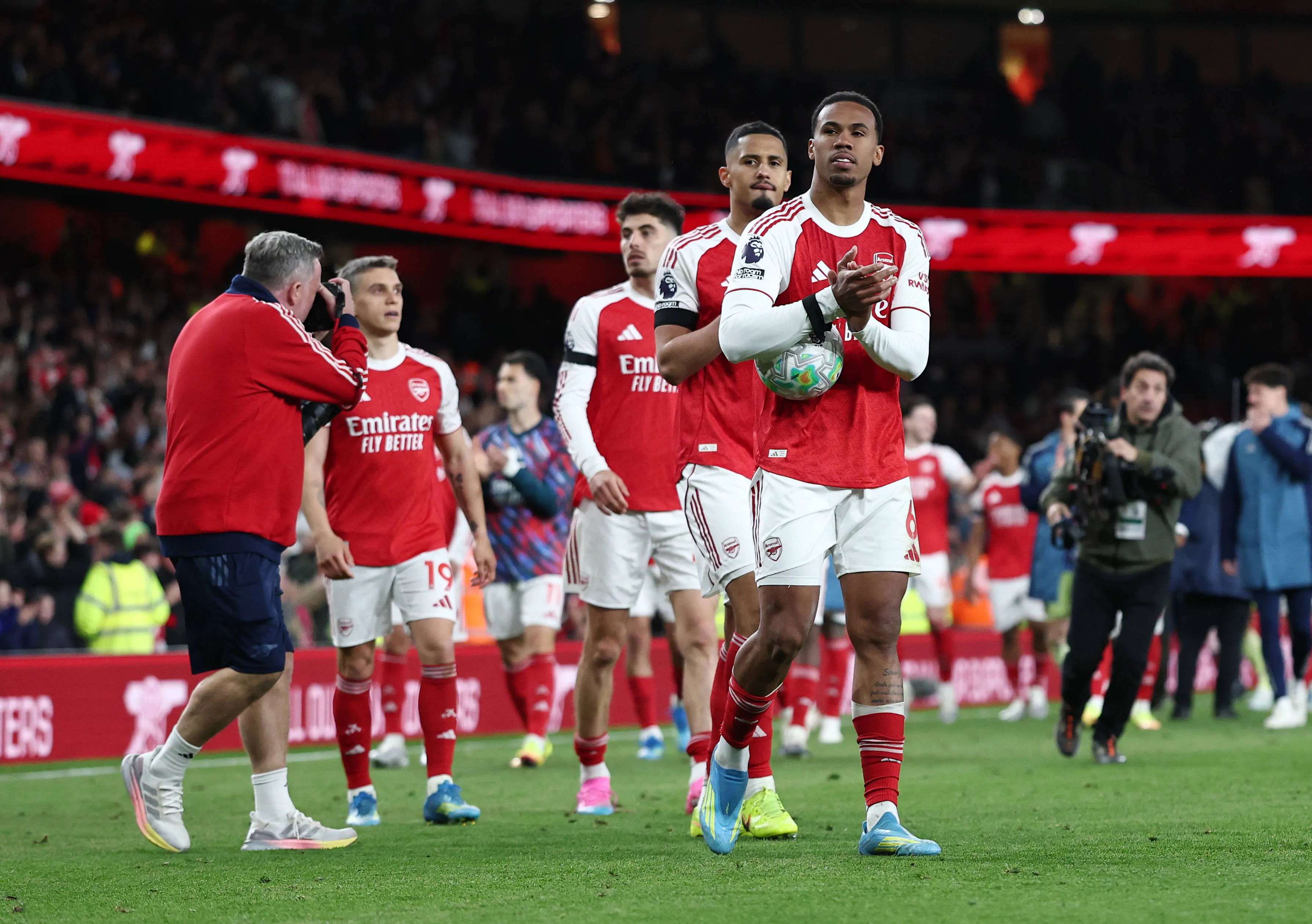 Gabriel of Arsenal leads a lap of appreciation in their last home game