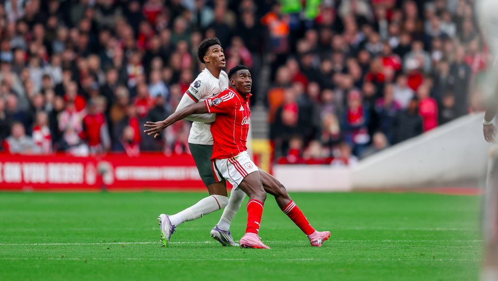Josh Acheampong challenges forward Taiwo Awoniyi during the Premier League match between Nottingham Forest and Chelsea at the City Ground, Nottingham, England