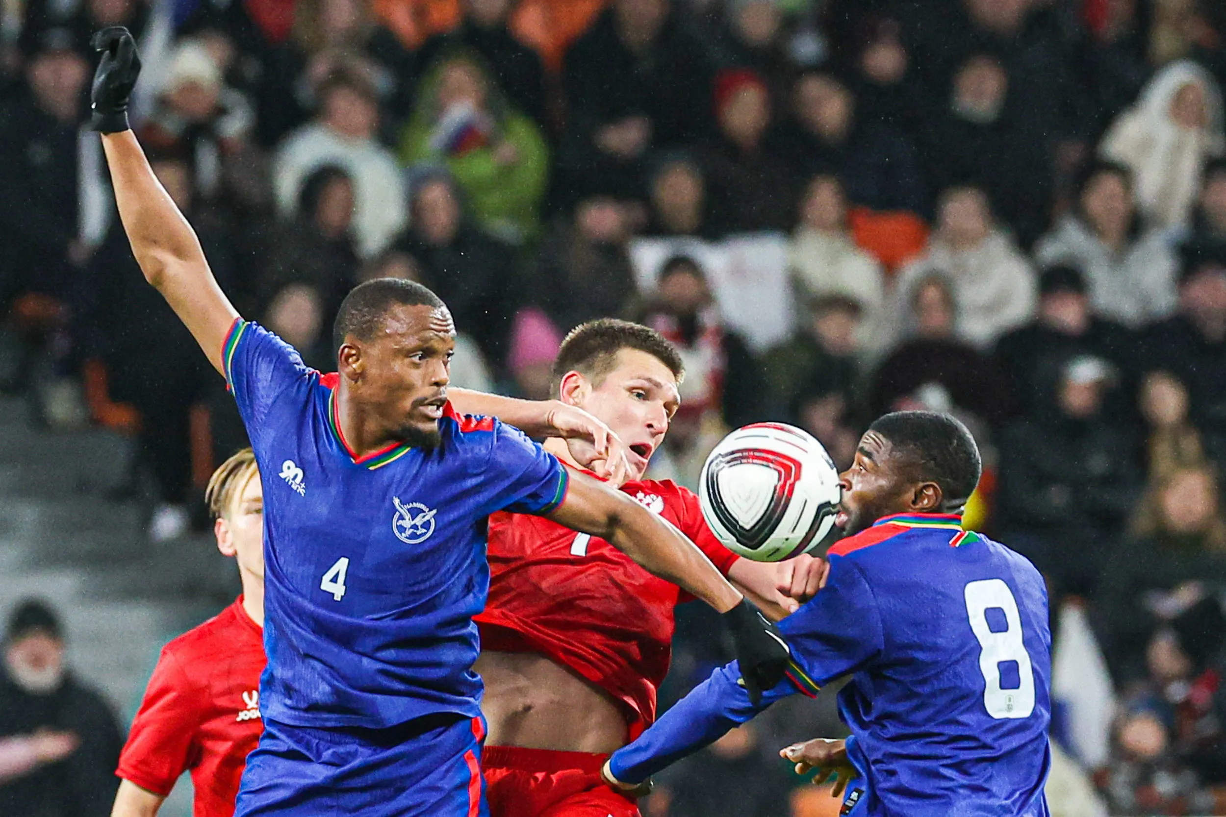 Namibia s Riaan Hanamub, Russia s Alexander Sobolev, and Namibia s Moses Shidolo L-R fight for the ball in a friendly football match between Russia and Namibia at Yekaterinburg Arena
