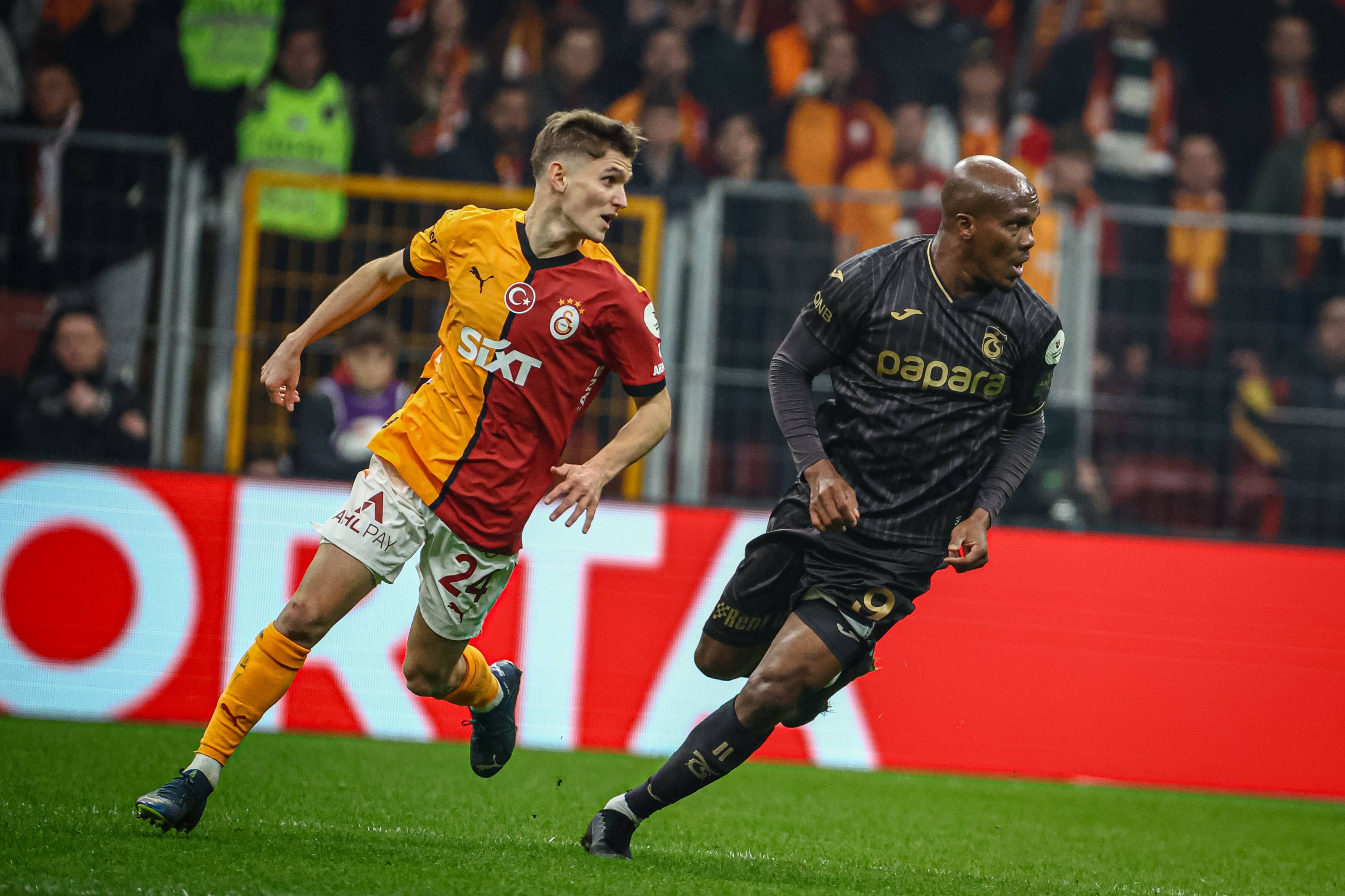 Elias Jelert of Galatasaray and Anthony Nwakaeme of Trabzonspor