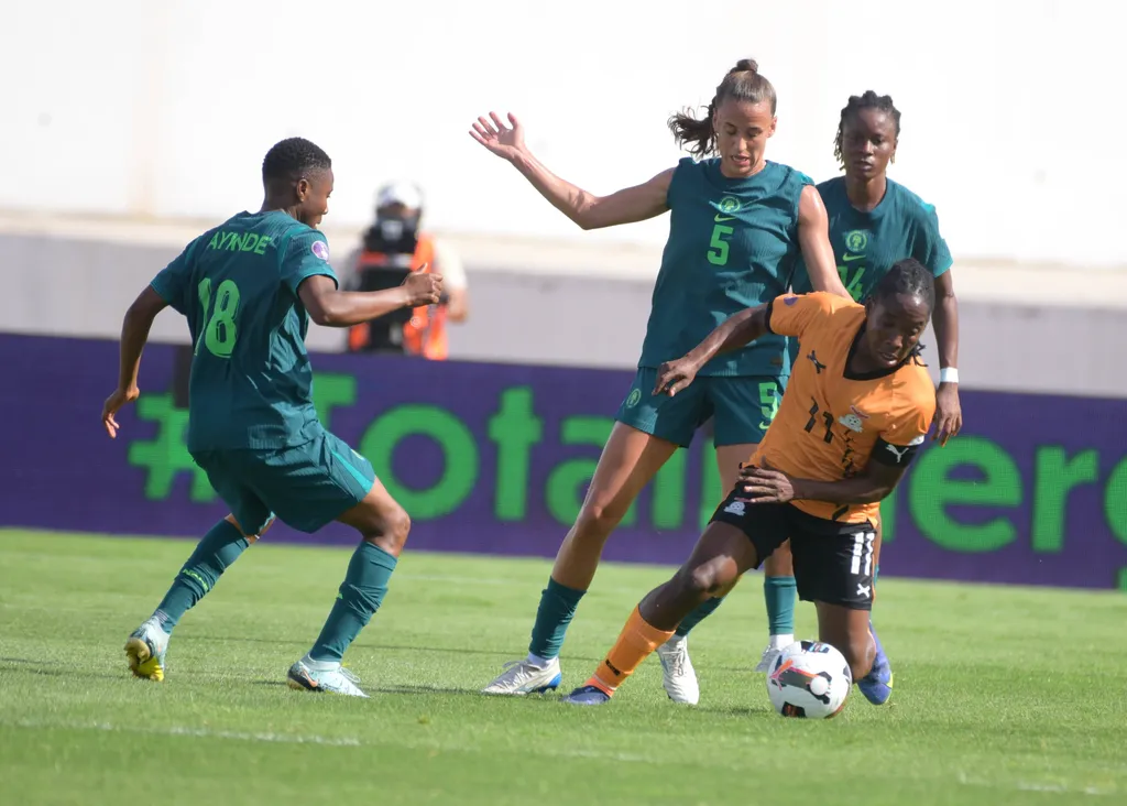Barbara Banda and Ashleigh Plumptre during the 2025 WAFCON quarter Finals match between Nigeria and Zambia at Stade Larbi Zaouli