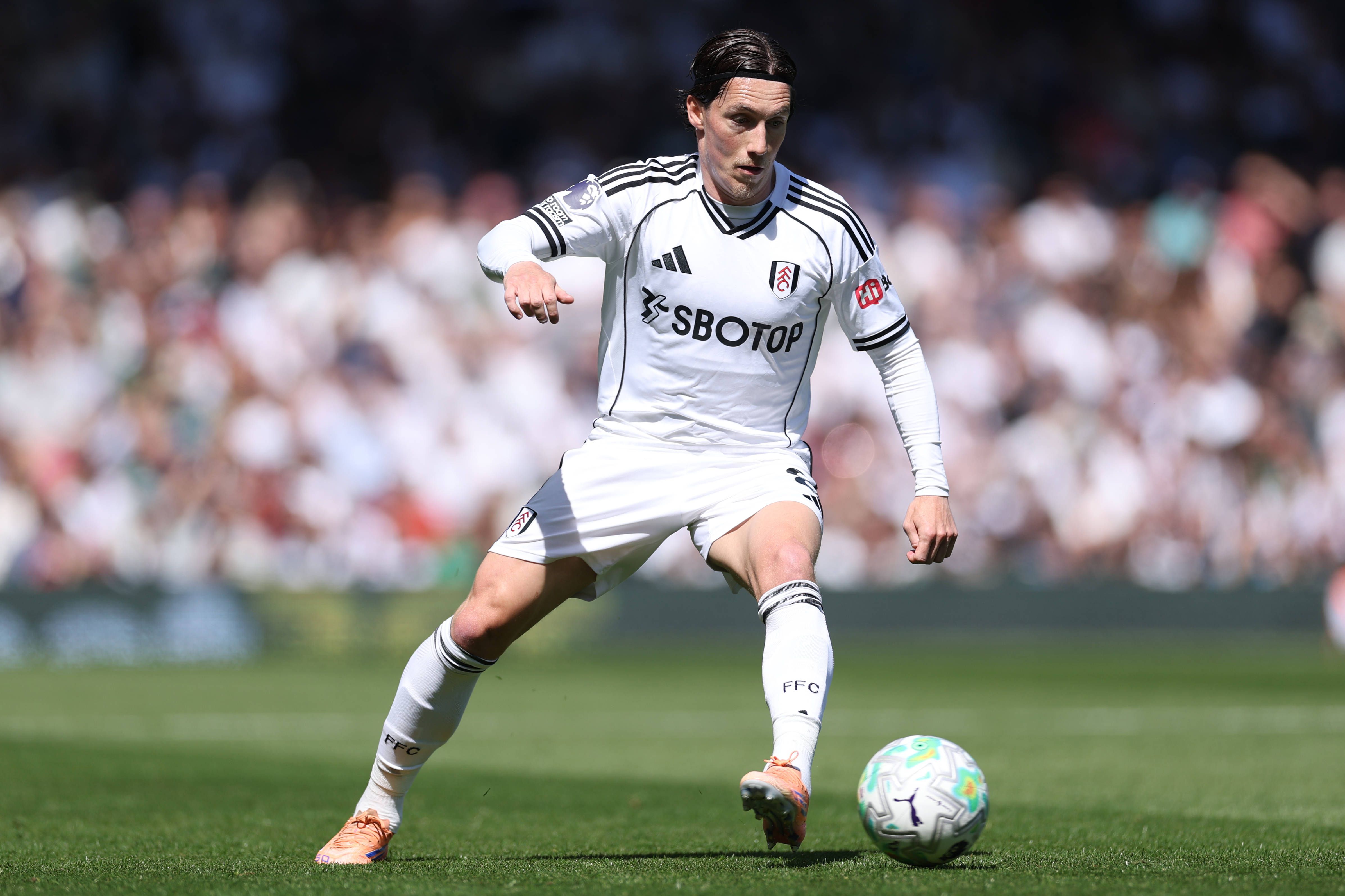 Harry Wilson of Fulham passes the ball during the Premier League match between Fulham and Aston Villa at Craven Cottage in London, United Kingdom, on April 25, 2026.