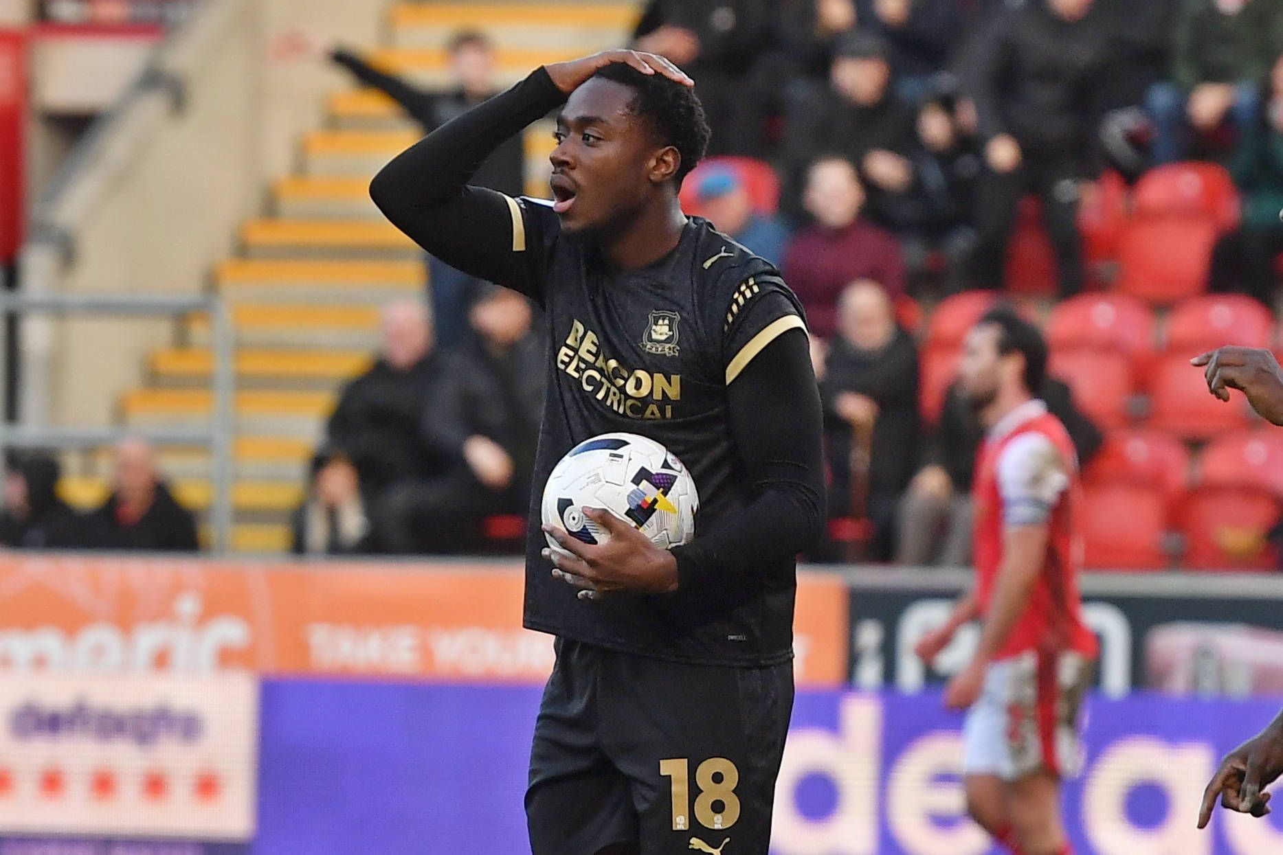 Plymouth Argyle forward Owen Oseni in despair at goal flagged offside
