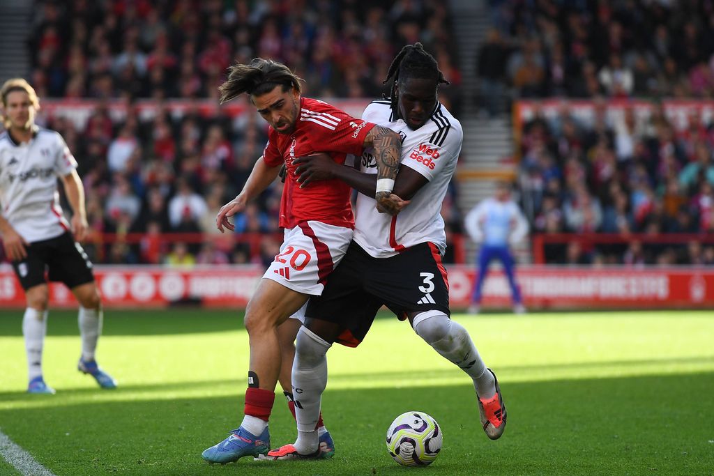 Jota Silva battles with Calvin Bassey during the Premier League match between Nottingham Forest and Fulham at the City Ground in Nottingham, England, on September 28, 2024. Nottingham