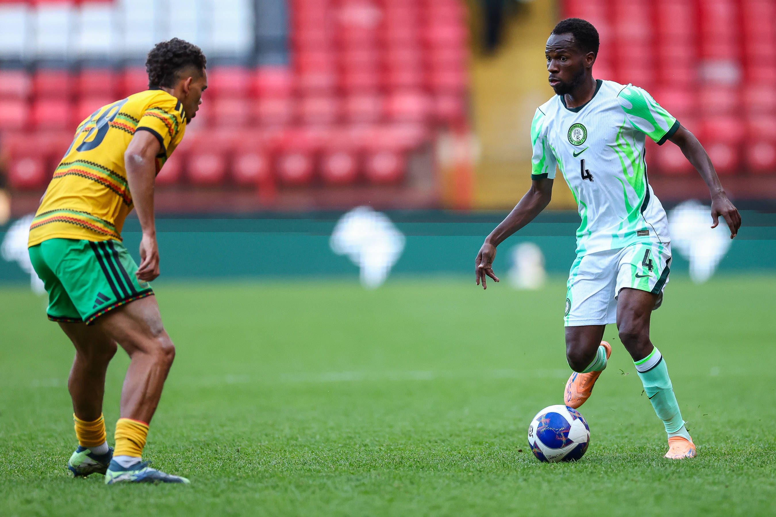 Super Eagles midfielder Alhassan Yusuf and Jamaica midfielder Brandon Cover