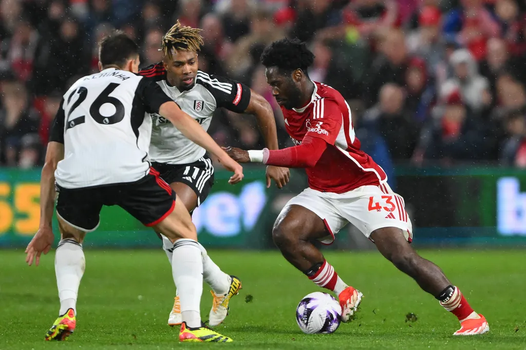 Ola Aina under pressure from Joao Palhinha and Adama Traore