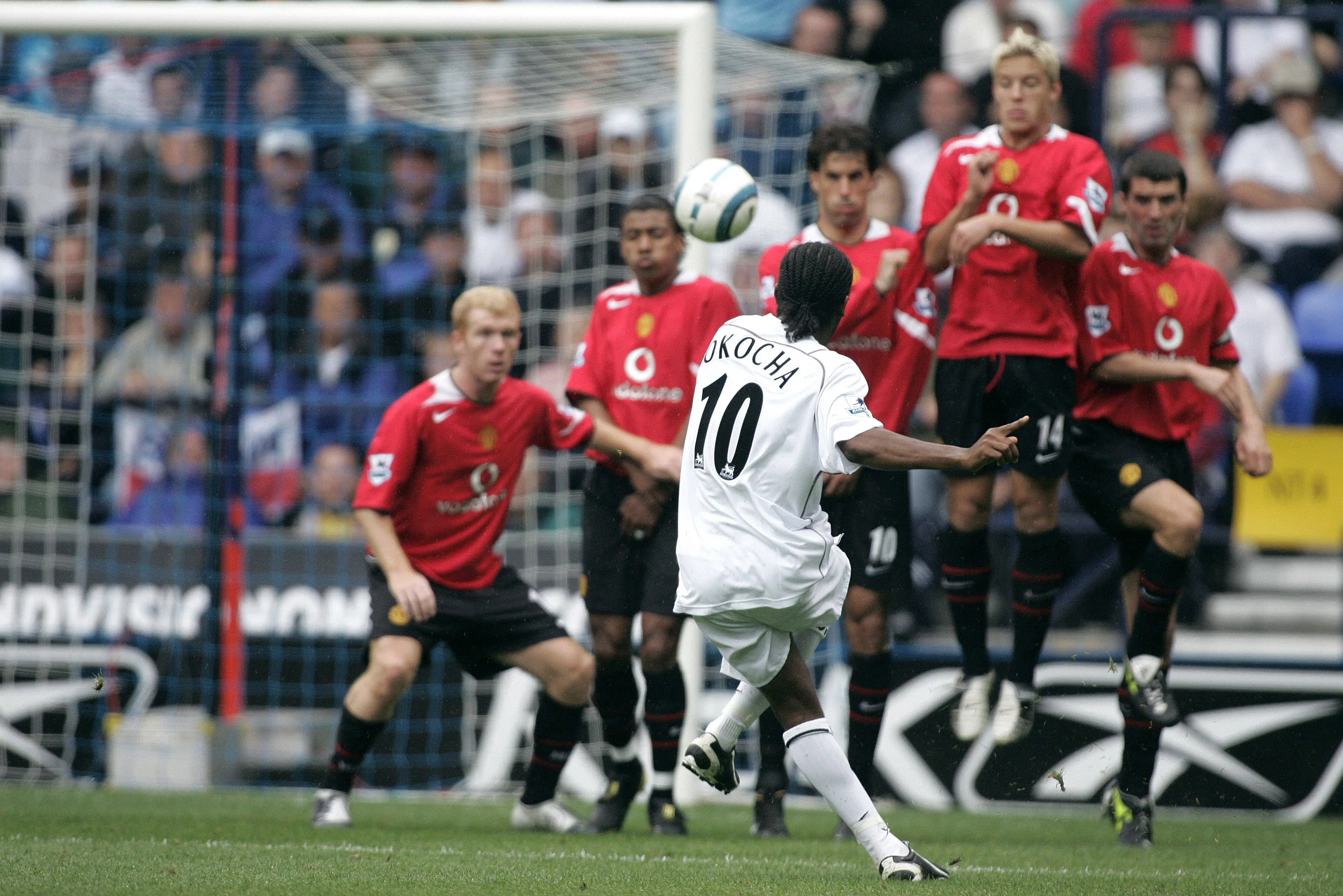 Jay Jay Okocha of Bolton Wanderers takes free kick against Manchester United at Reebok Stadium