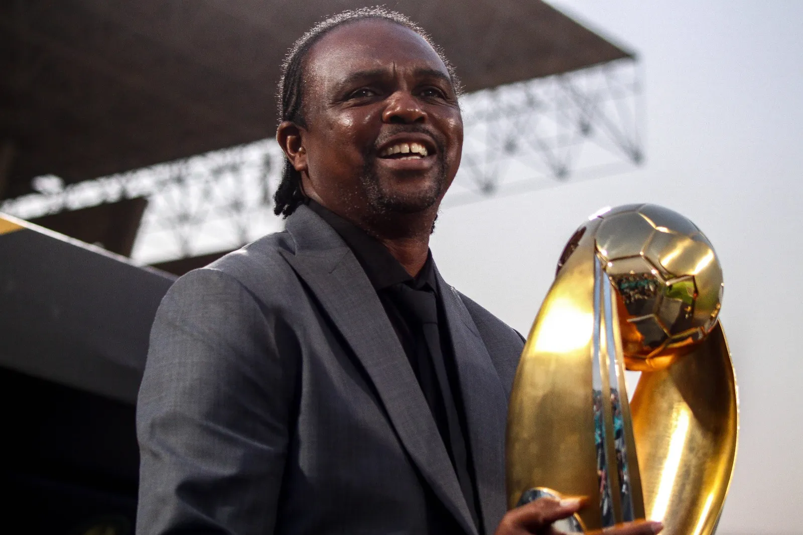 Kanu Nwankwo with CAF Champions League trophy